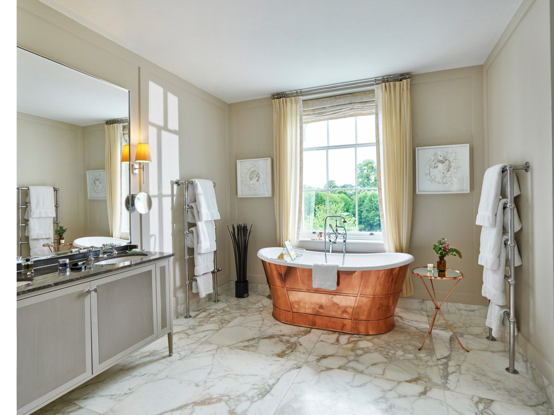 Mansion House Premium Suite bathroom with copper bath by the window at Coworth Park, Ascot