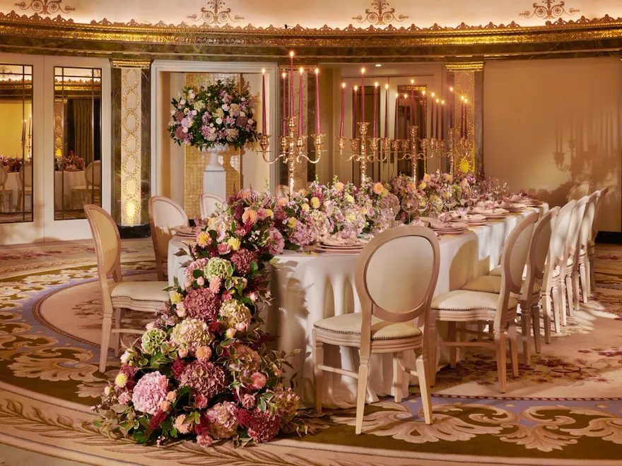 The Dorchester Gold and Silver event space set of fabulous evening event with a stunning floral centre perice