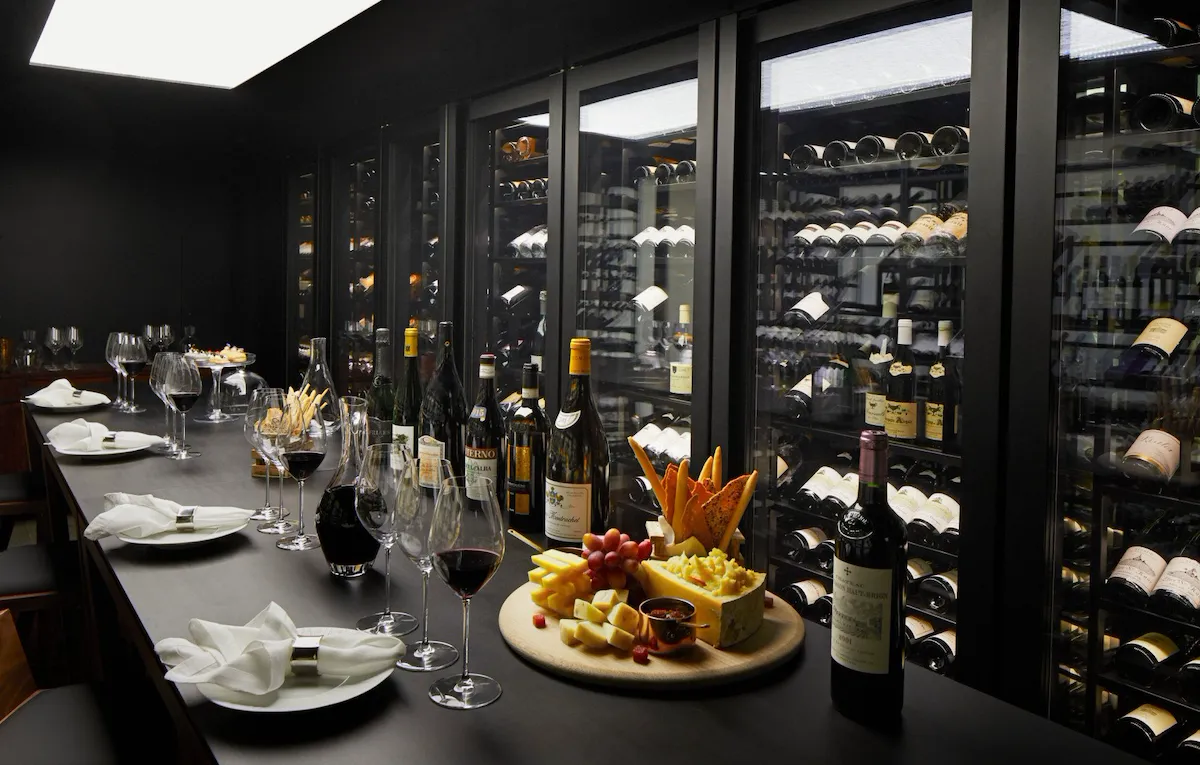 The Dorchester The Wine Vault, red wine being poured and cheese and fruit