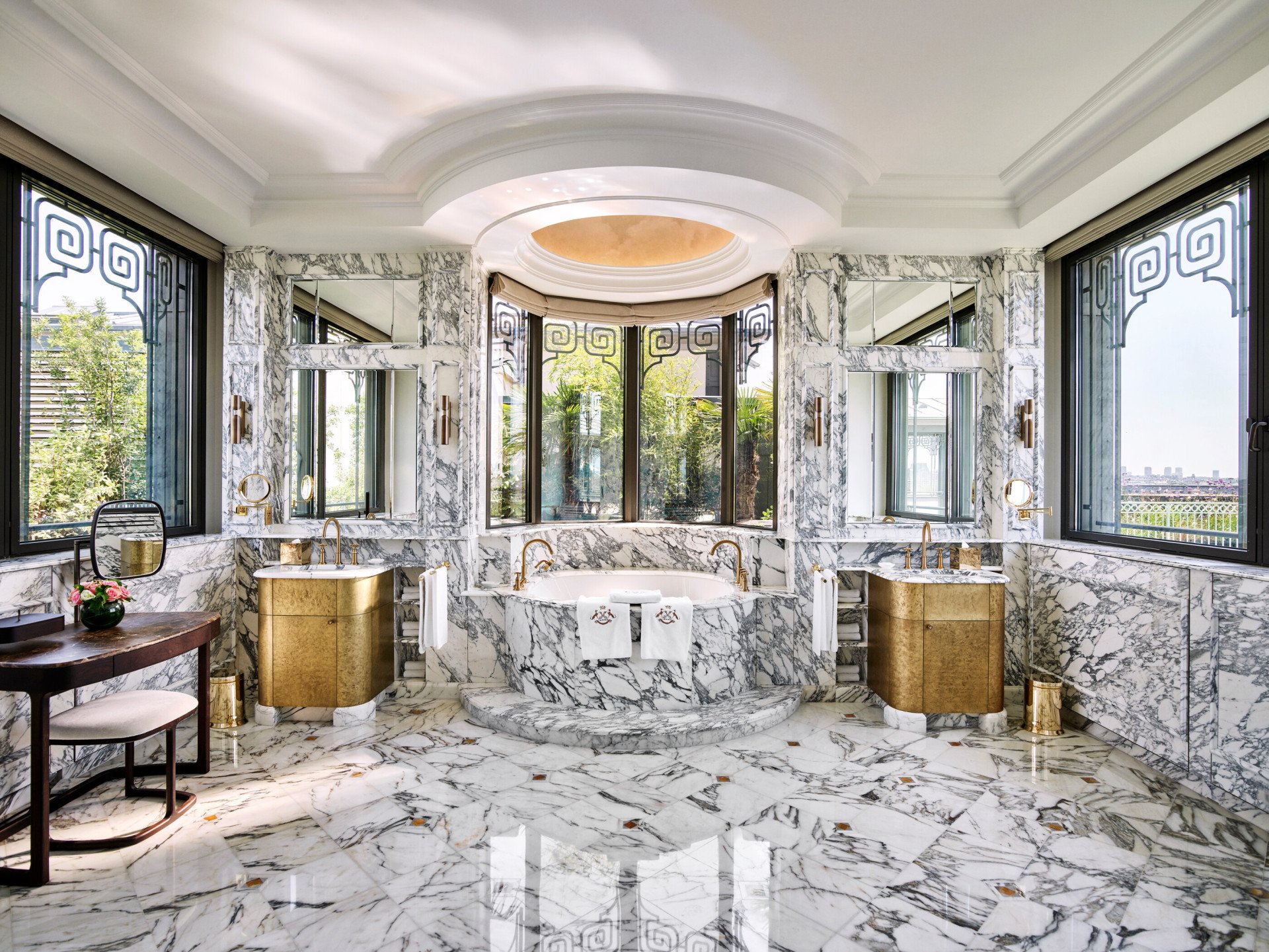 Marble bathroom with circular bathtub in Belle Etoile suite at Le Meurice, Paris