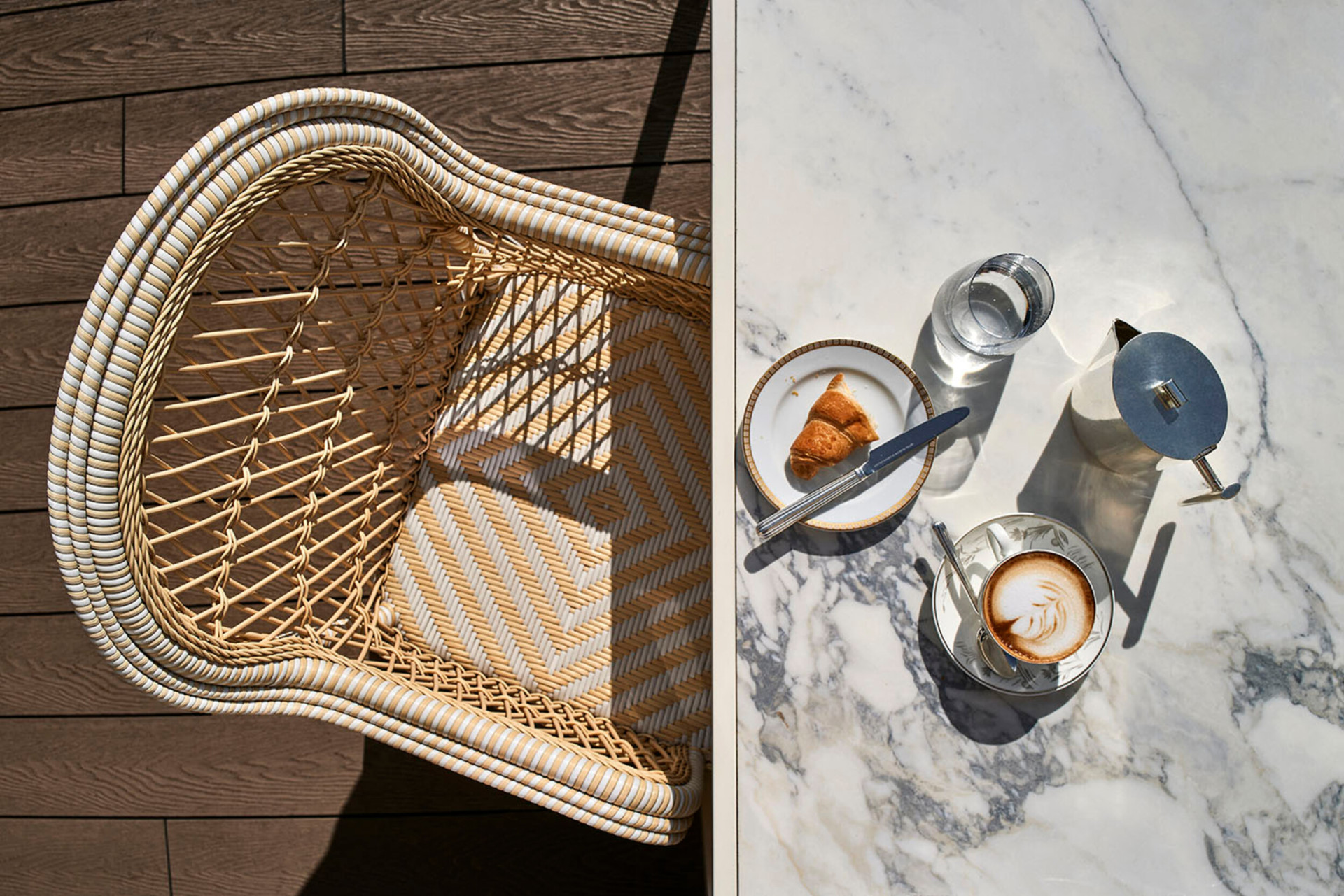 View from the top of a  marble table with breakfast (coffee, brioches)