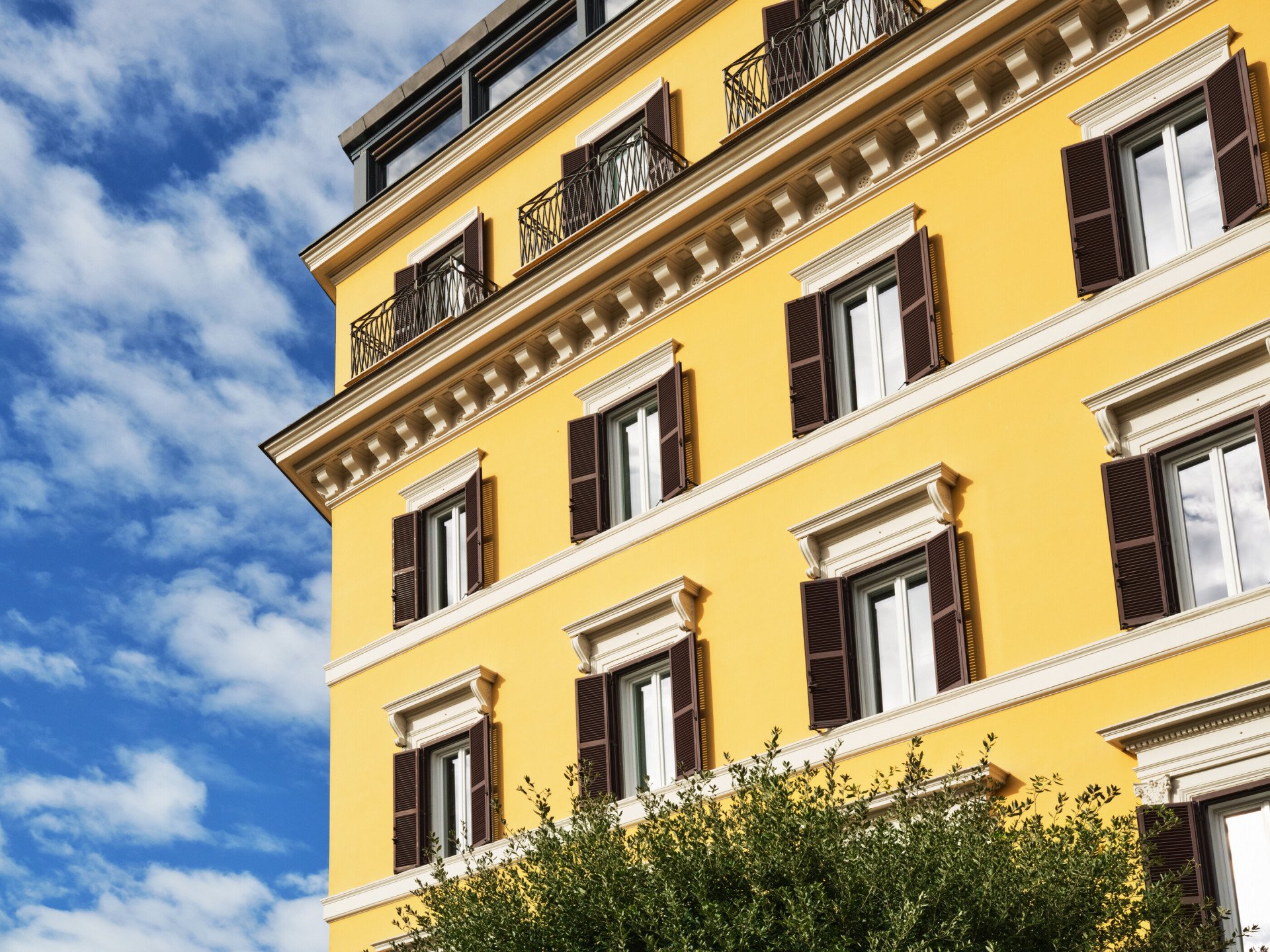 Detail of Hotel Eden facade daylight 