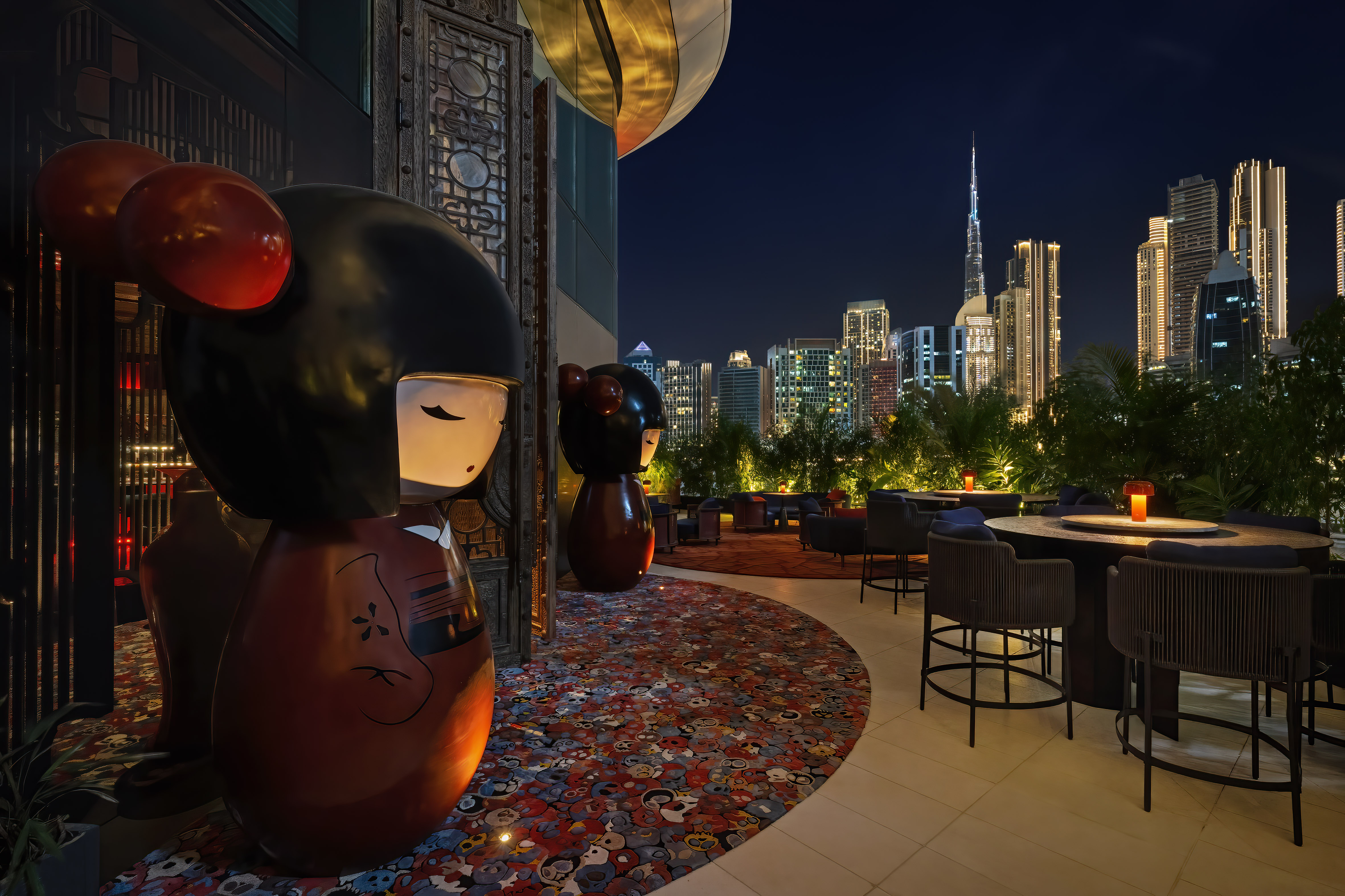 Outdoors seating area of Dragonfly, with view of Dubai Downtown