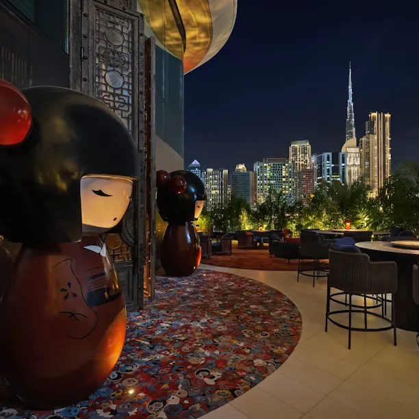 Outdoors seating area of Dragonfly, with view of Dubai Downtown