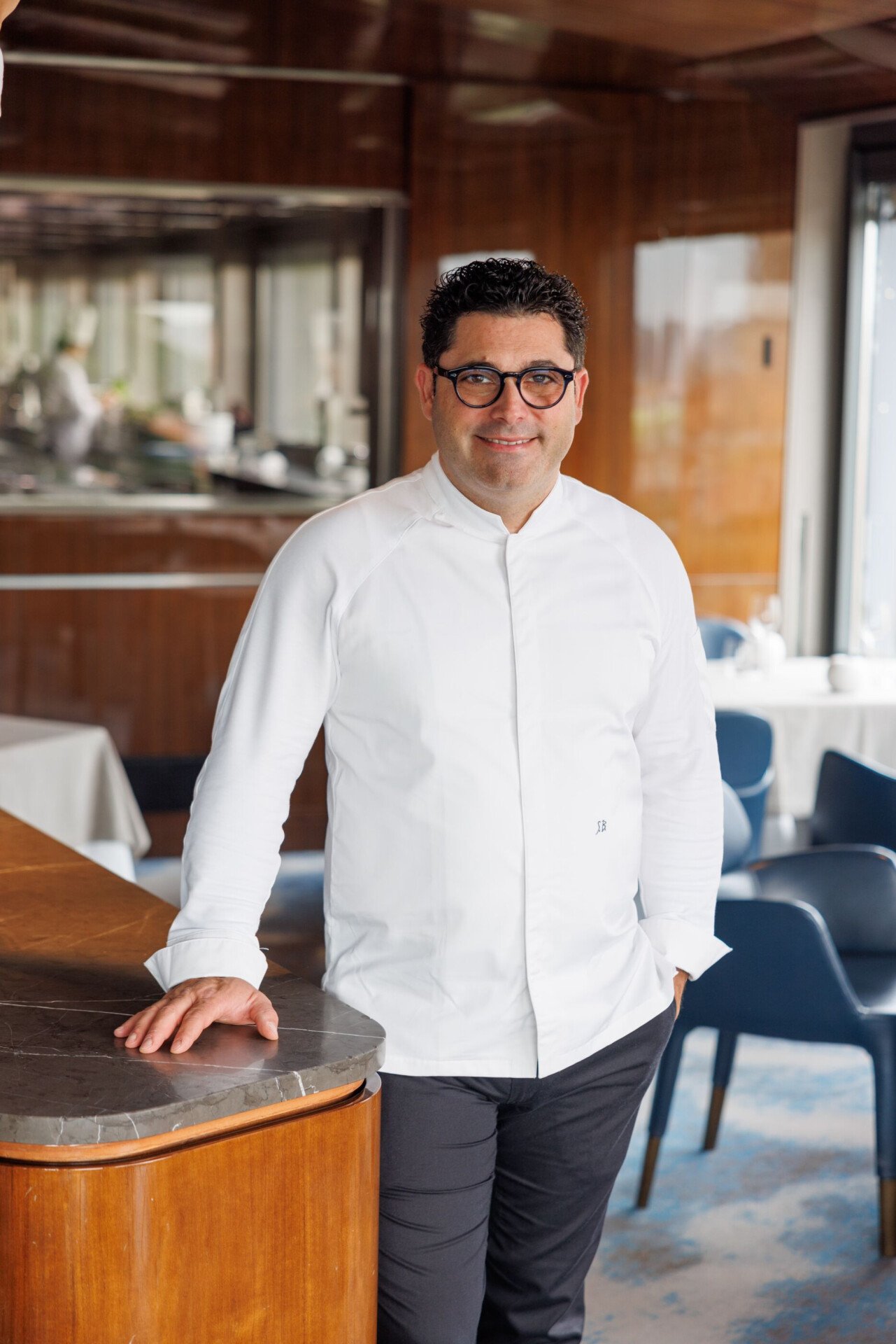 Portrait of executive chef Salvatore Bianco standing inside restaurant La Terrazza at Hotel Eden Roma