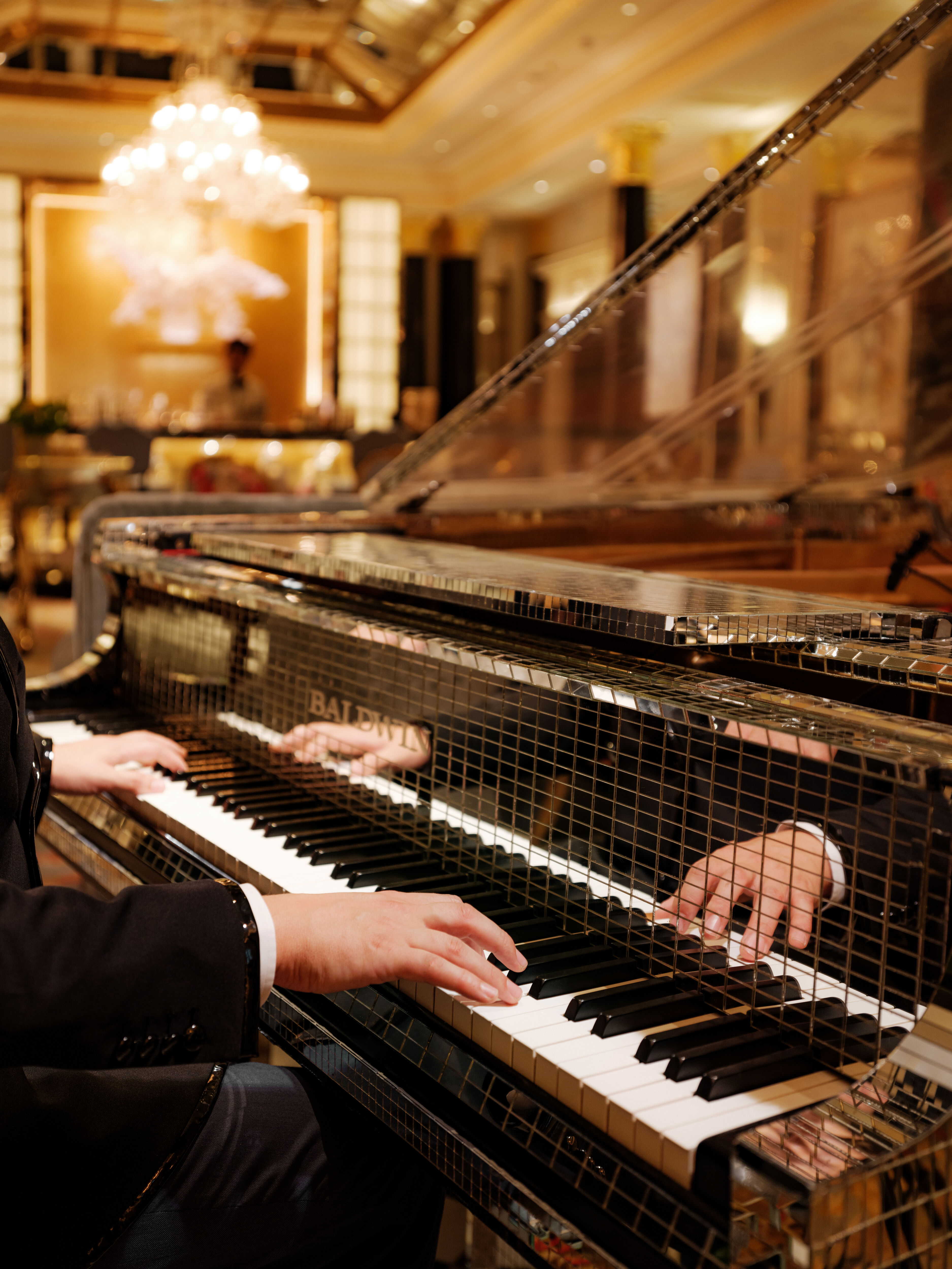 The Dorchester Artists Bar Liberace Piano close up with pianist playing