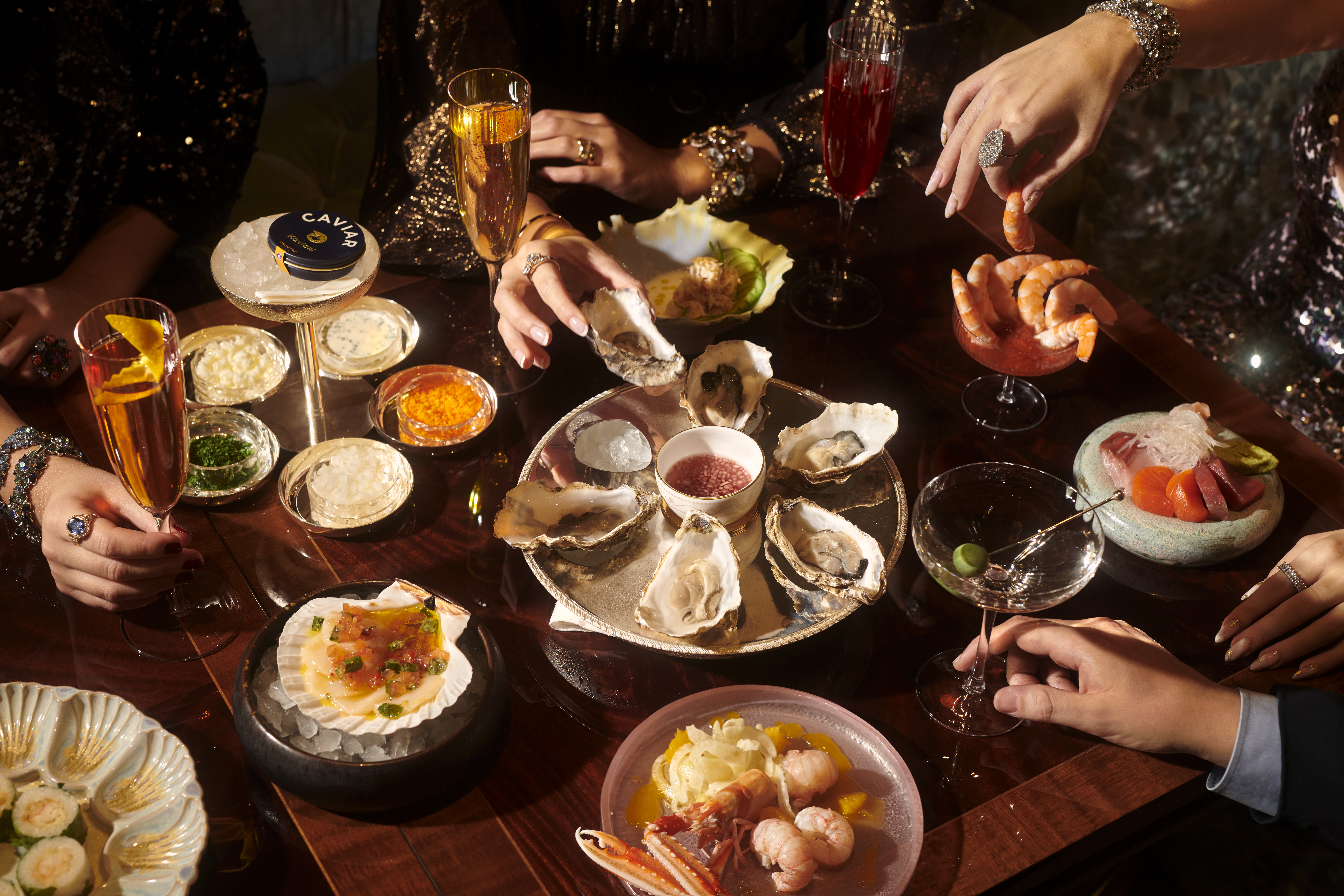Lifestyle dining image with raw seafood selection 