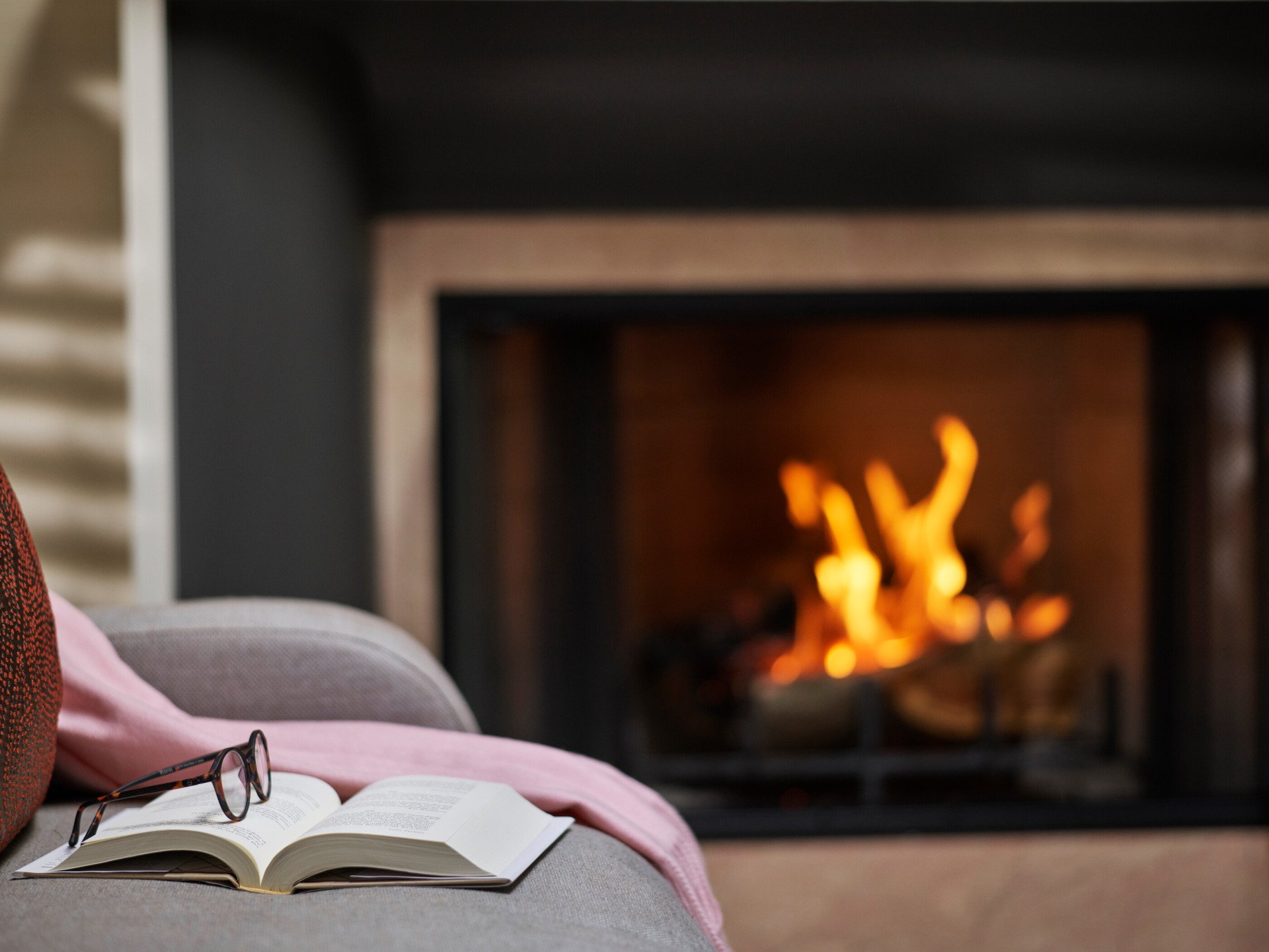 Book and glasses next to fireplace in Deluxe Bungalow Suite at The Beverly Hills Hotel, Los Angeles 
