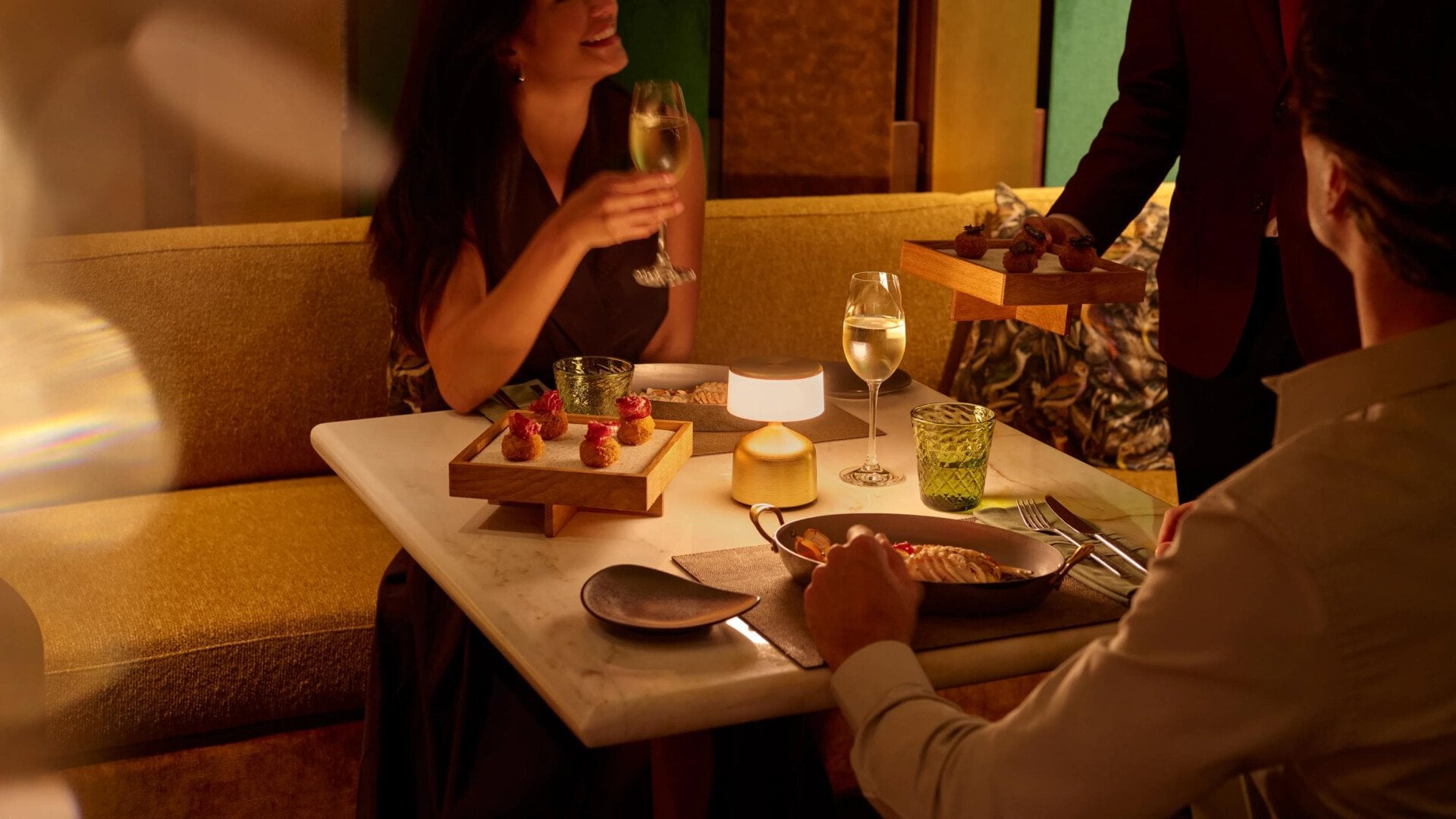 A couple enjoying drinks at Jara by Martin Berasategui