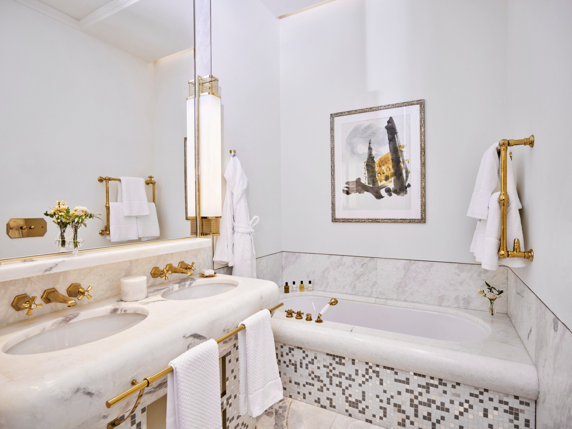 Marble bathroom with double sinks and bathtub of Prestige Suite at Hotel Eden, Rome