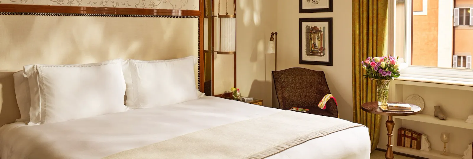 Bedroom of prestige room, headboard with peacocks illustration and window with view, at Hotel Eden, Rome