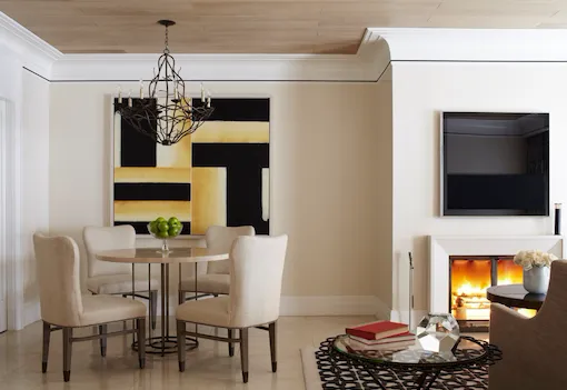Dining table for four in the Stone Canyon suite with fireplace