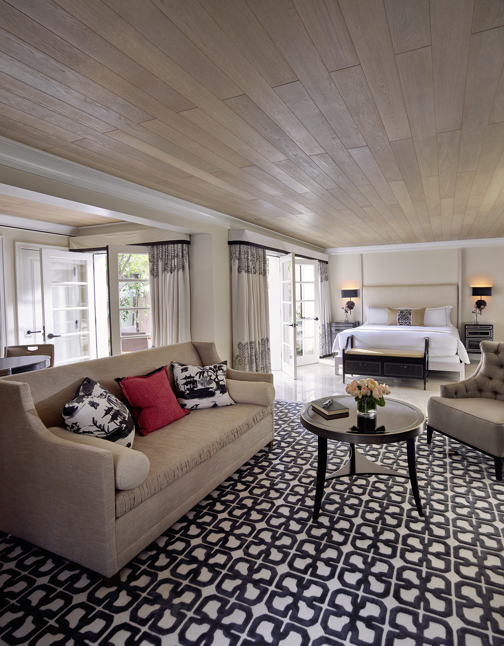 Junior Suite view from sitting area towards king bed and private