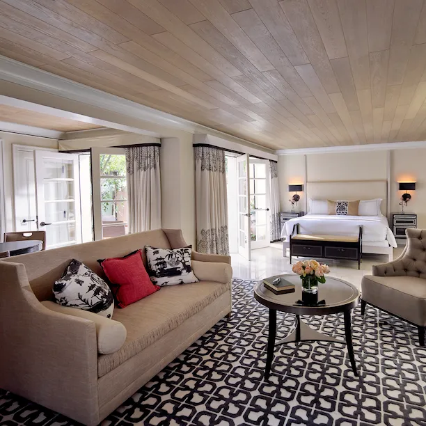 Junior Suite view from sitting area towards king bed and private