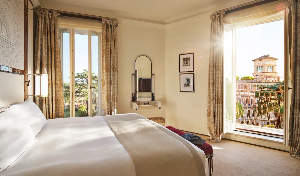 Bedroom of Villa Medici Presidential Suite with view of Villa Malta at Hotel Eden, Rome