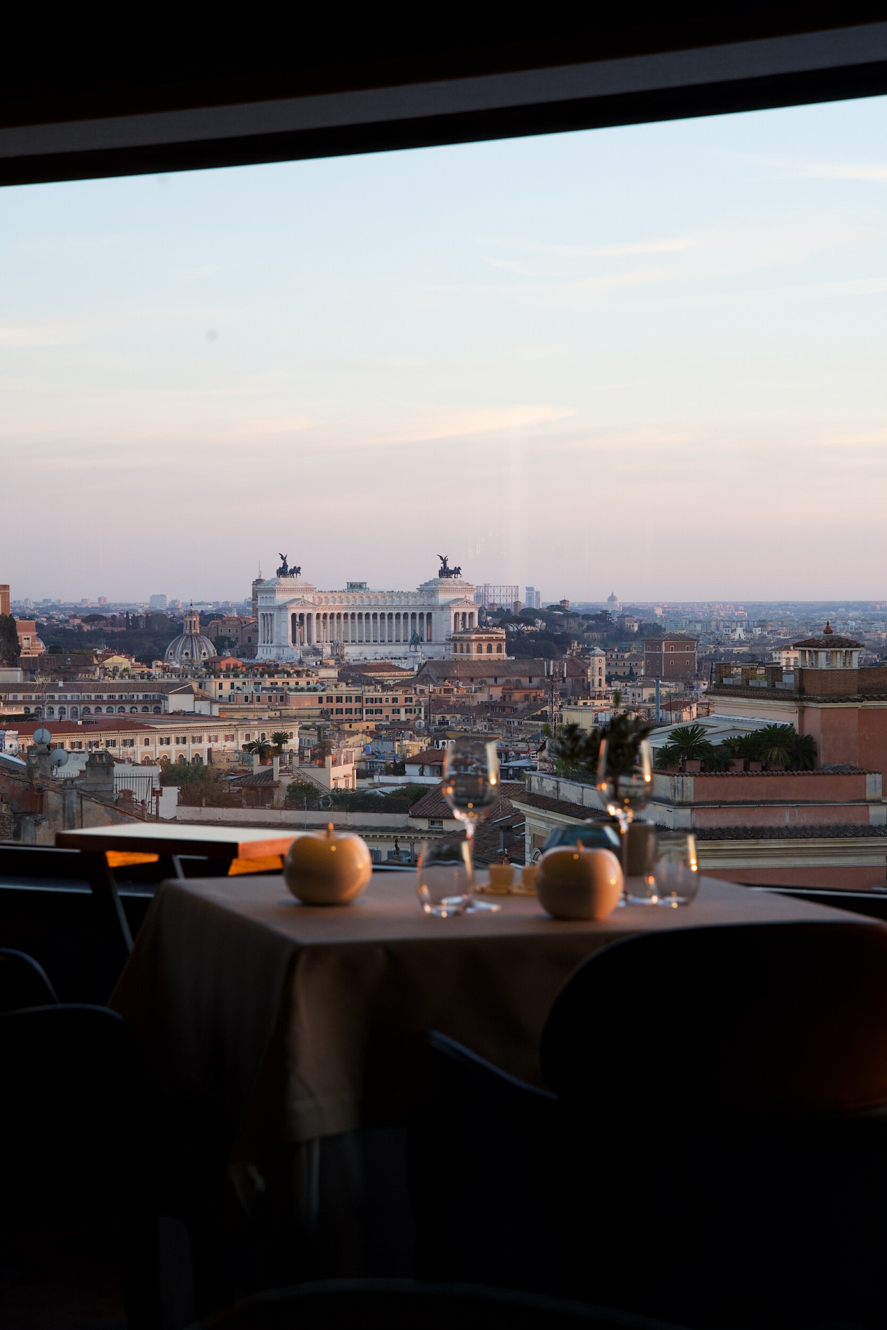 Table by the window at La Terrazza restaurant with view of Altare della Patria, Hotel Eden, Rome