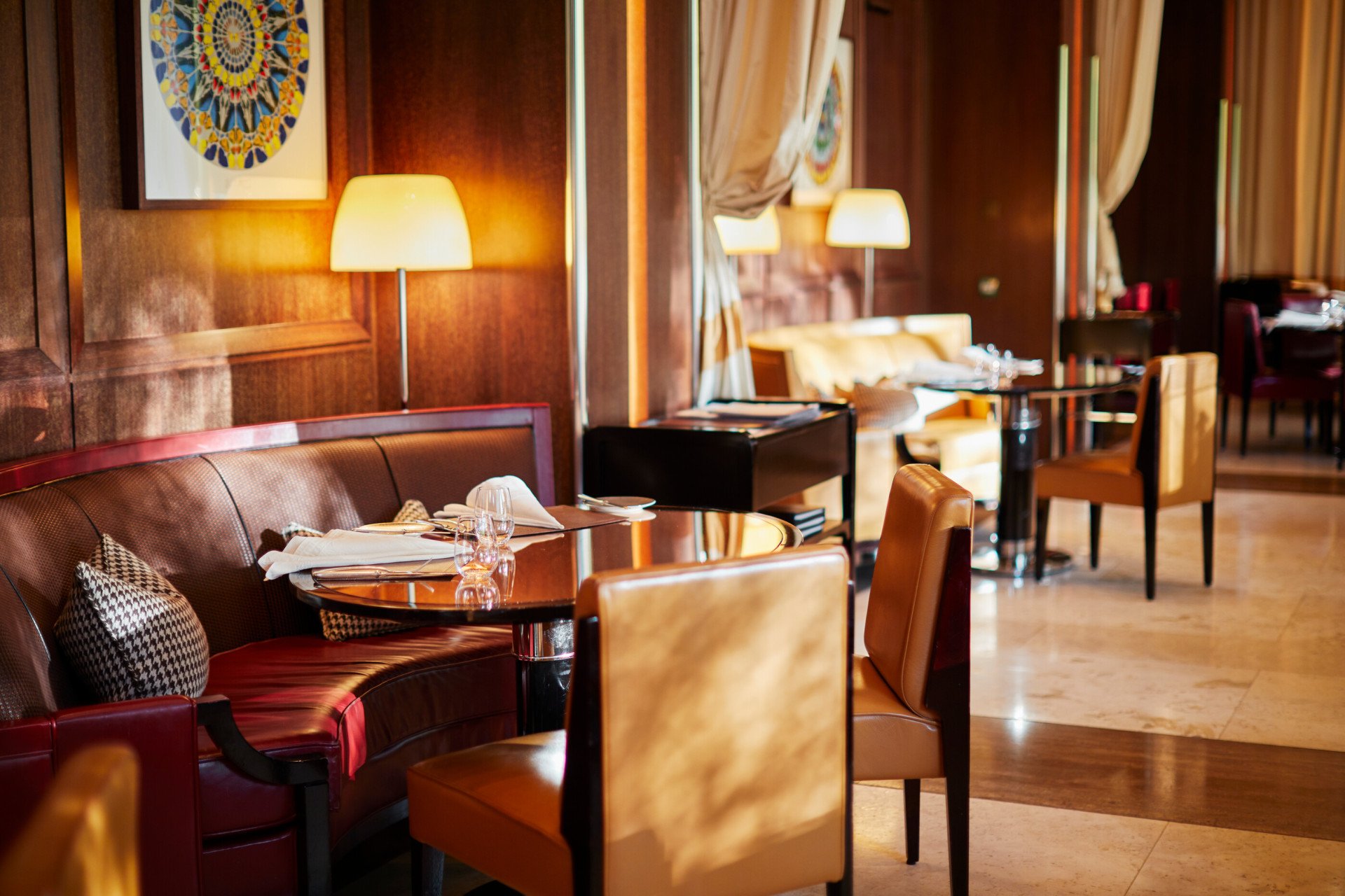 Table at CUT restaurant set for lunch with sun streaming in, at 45 Park Lane, London