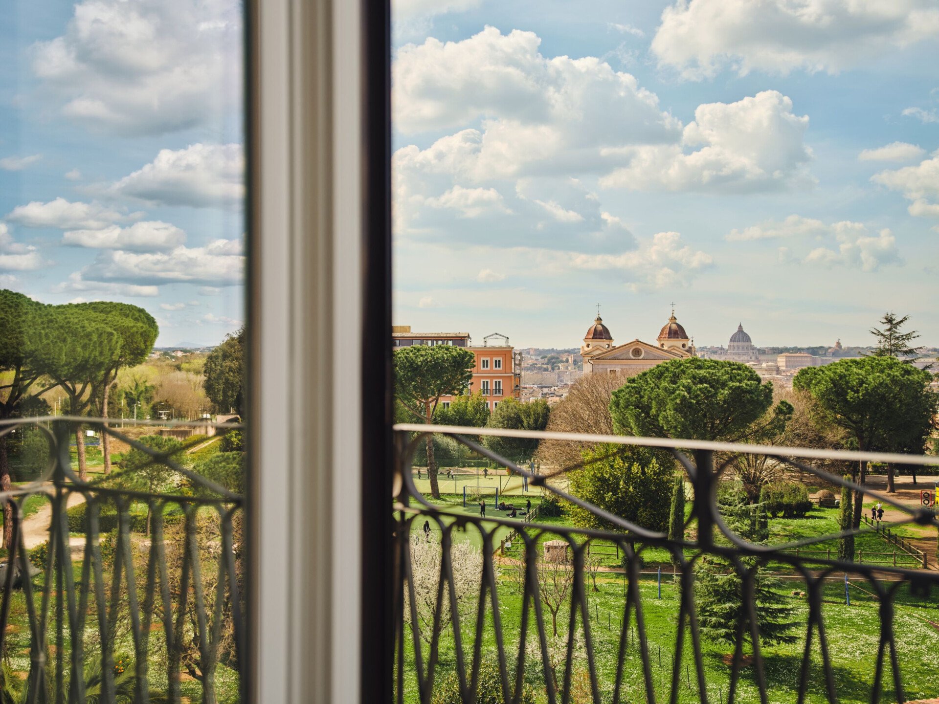 View of Villa Medici gardens, Trinità dei Monti and St. Peter's Dome from a guestroom at Hotel Eden