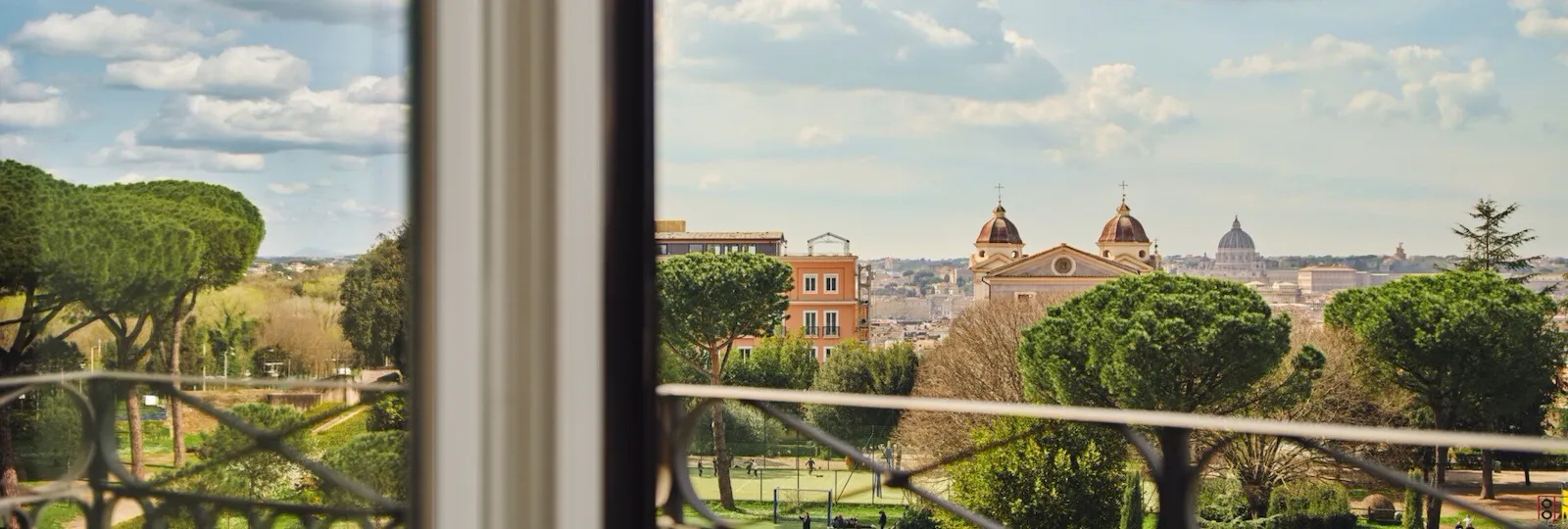 View of Villa Medici gardens, Trinità dei Monti and St. Peter's Dome from a guestroom at Hotel Eden