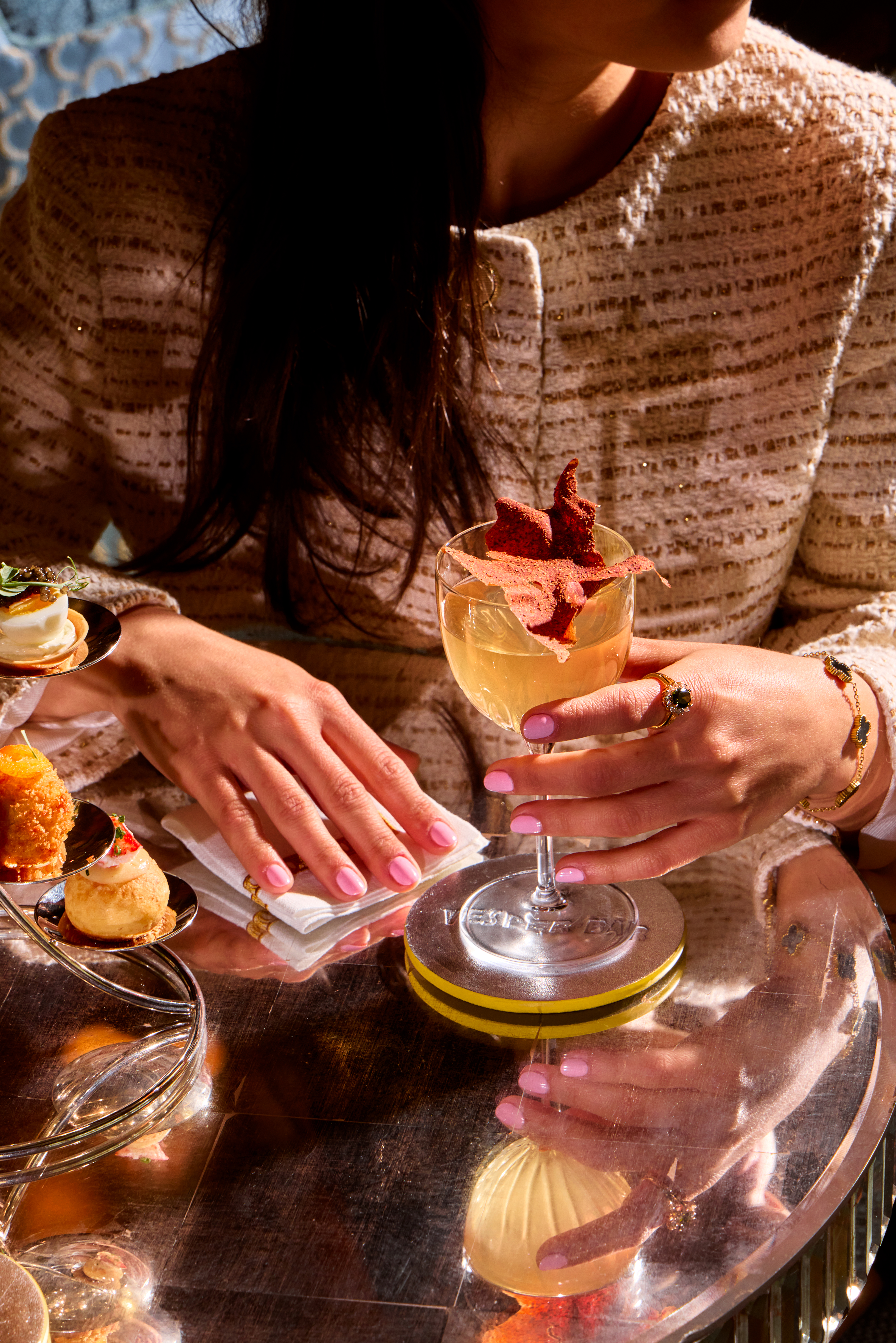 The Dorchester Vesper Bar Eterna woman with cocktail