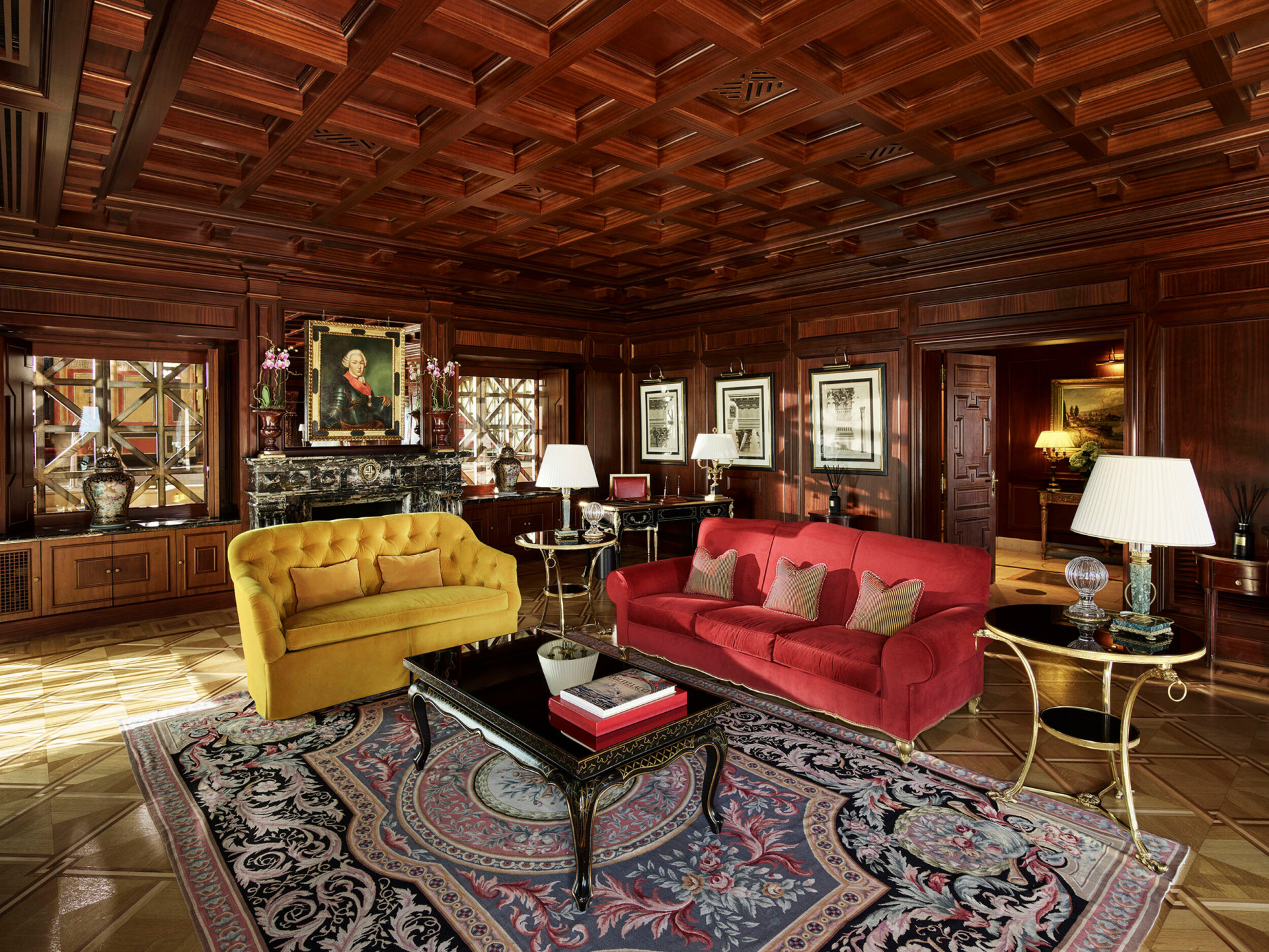 View of the living room of Presidential Suite with the iconic carpet and armchairs