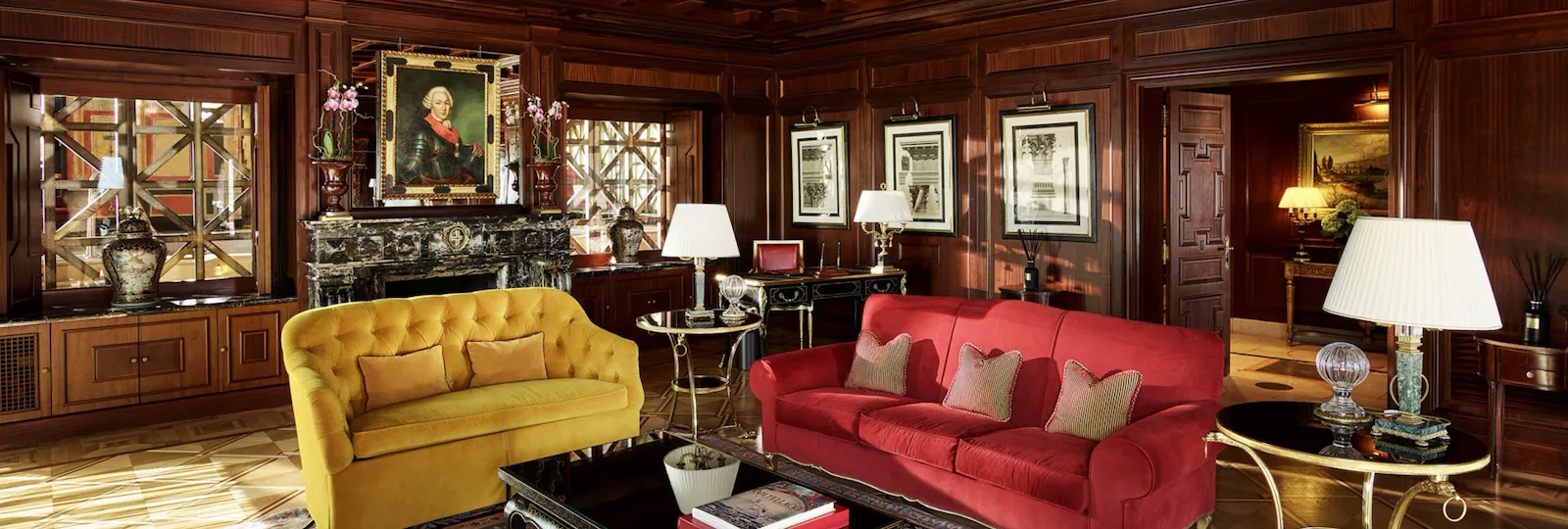 View of the living room of Presidential Suite with the iconic carpet and armchairs
