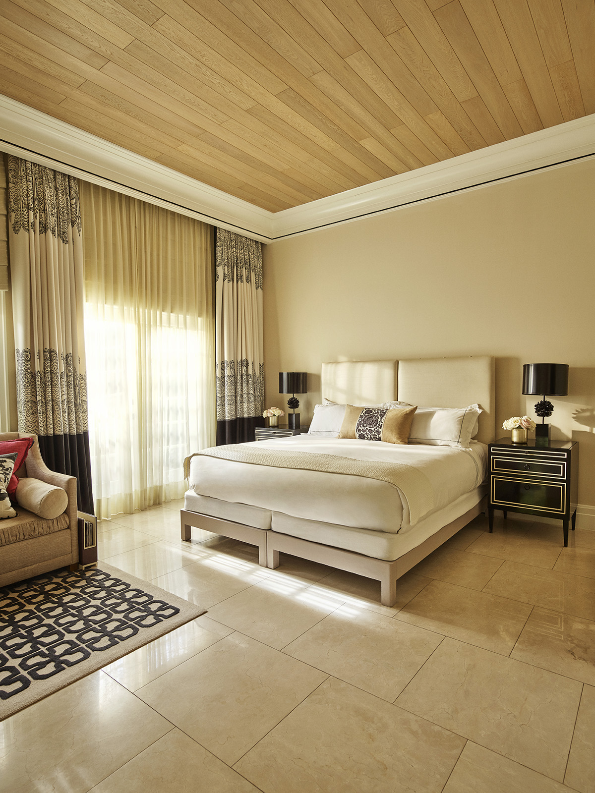 Deluxe guestroom with patio and ray of light coming in