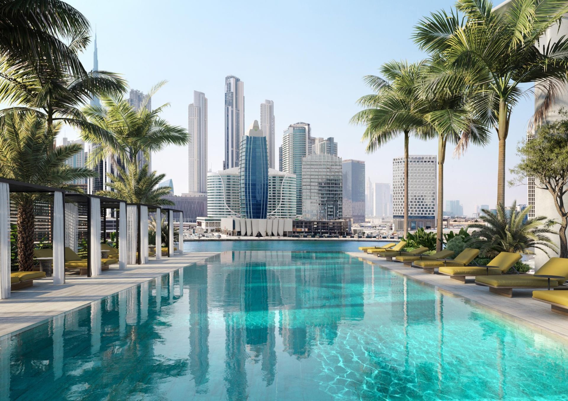 Swimming pool with palm trees with view of city from The Residences Dubai