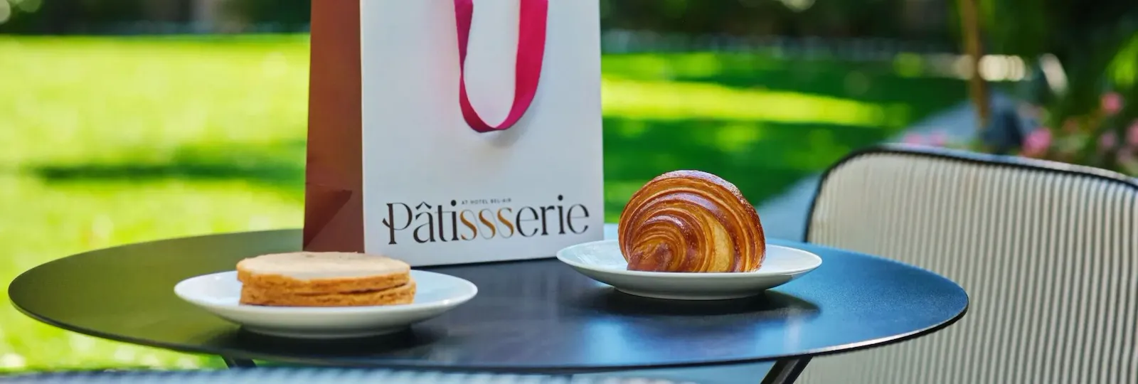 Coffee and croissant close-up moment in The Patisserie courtyard