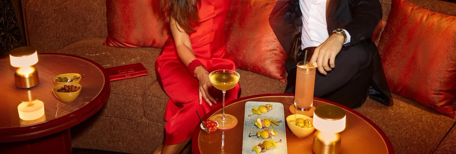 A couple enjoying drinks at Jara by Martin Berasategui