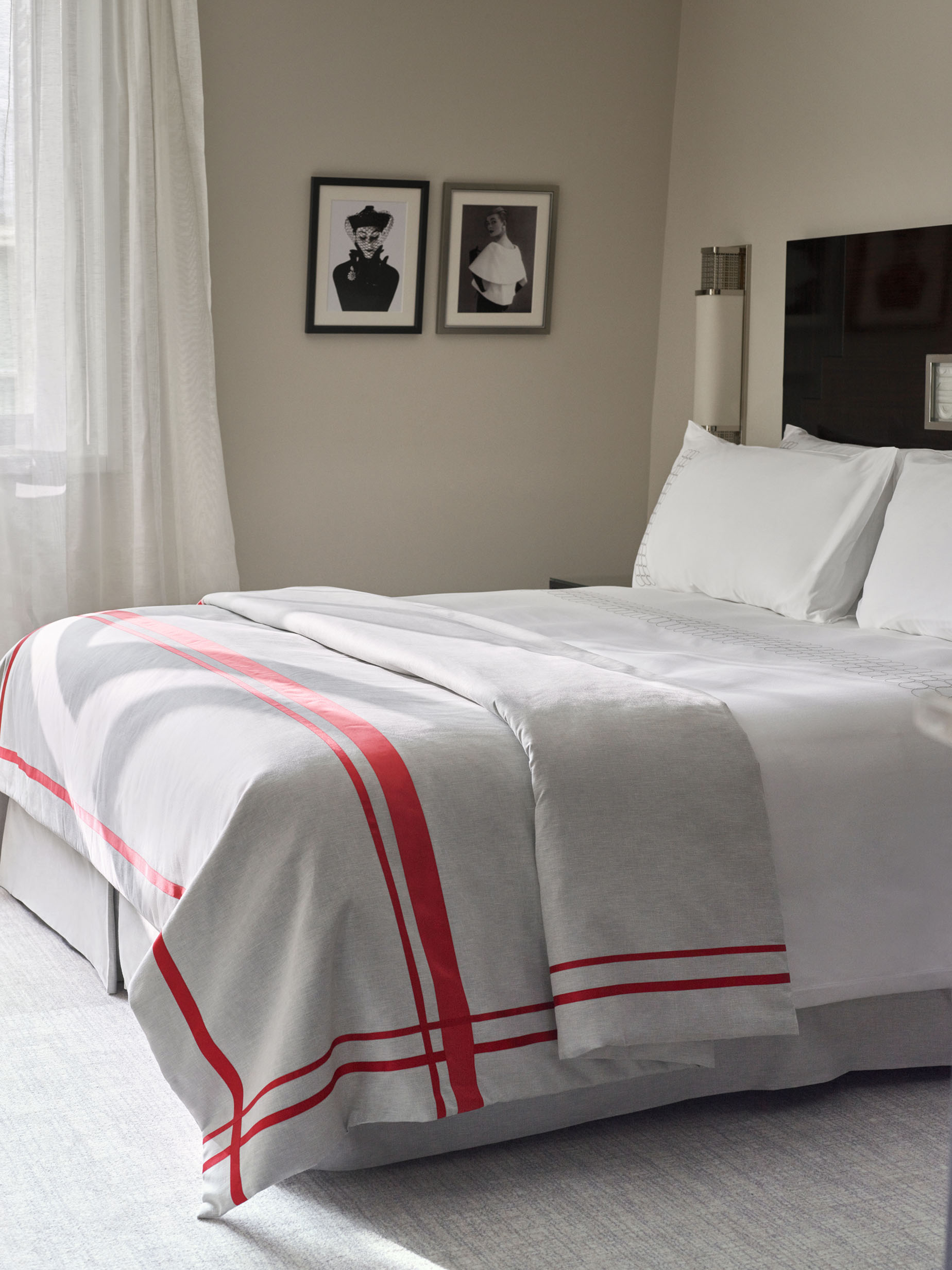 Photo of the bed in the superior rooms with an art deco style