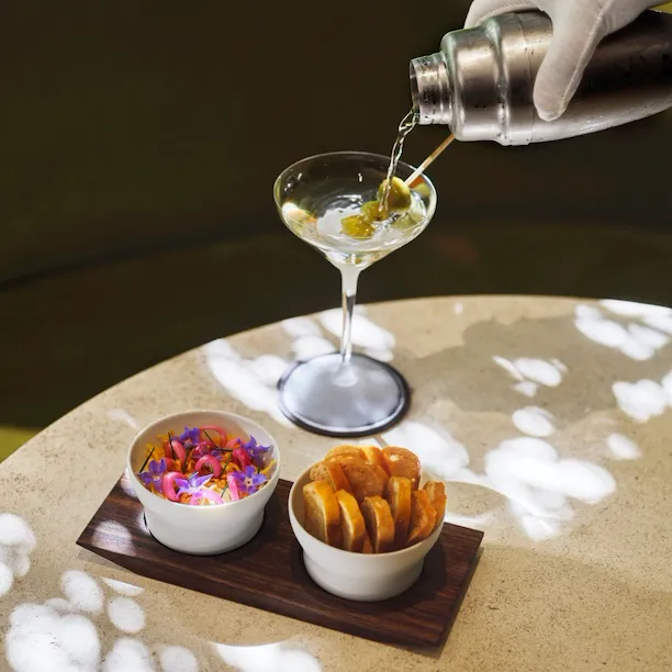 Vidalia onion dip and a martini pour in The Living Room