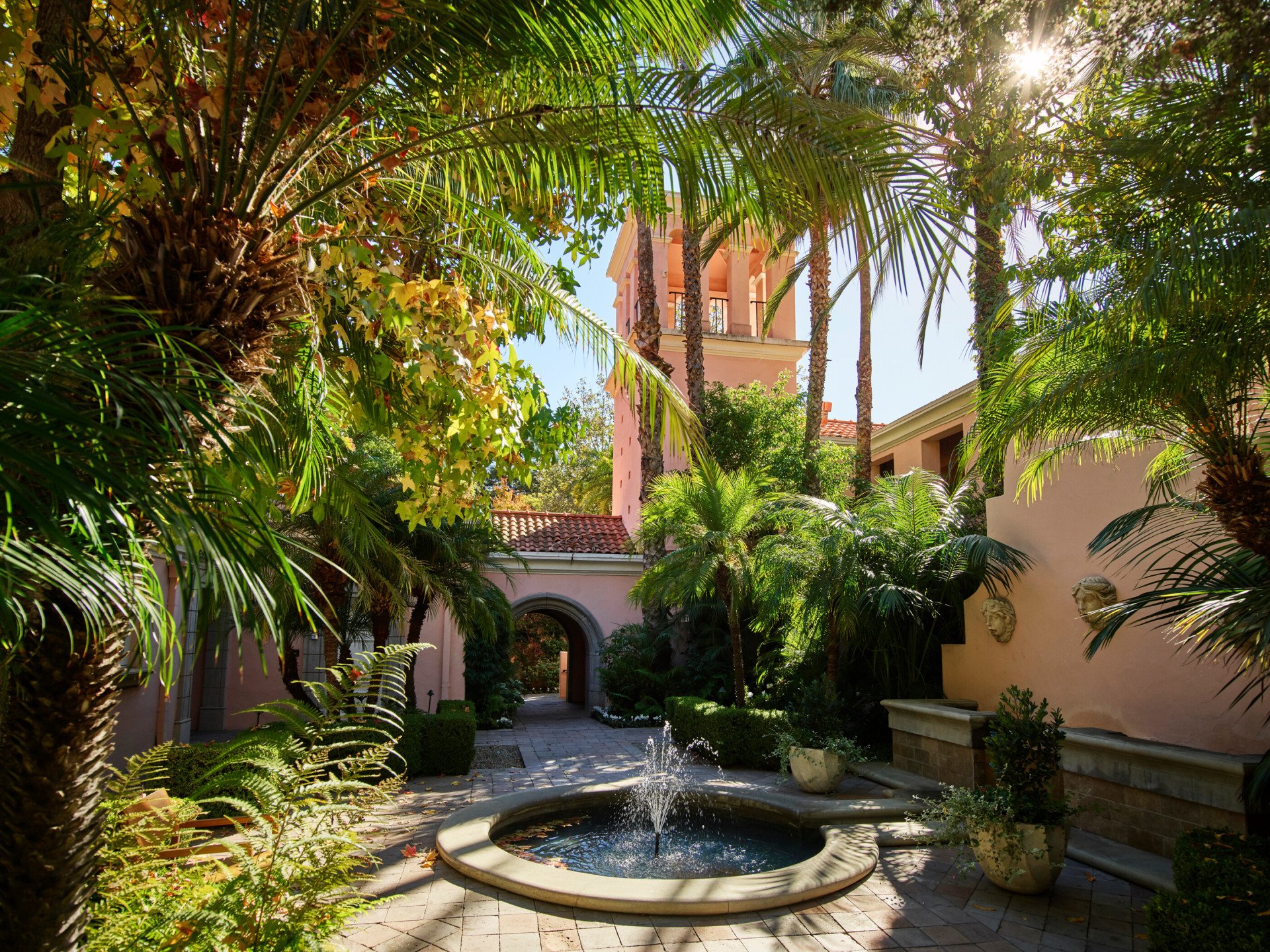 Courtyard with fountain and palm trees at Hotel Bel-Air
