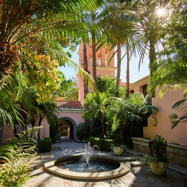 Courtyard with fountain and palm trees at Hotel Bel-Air