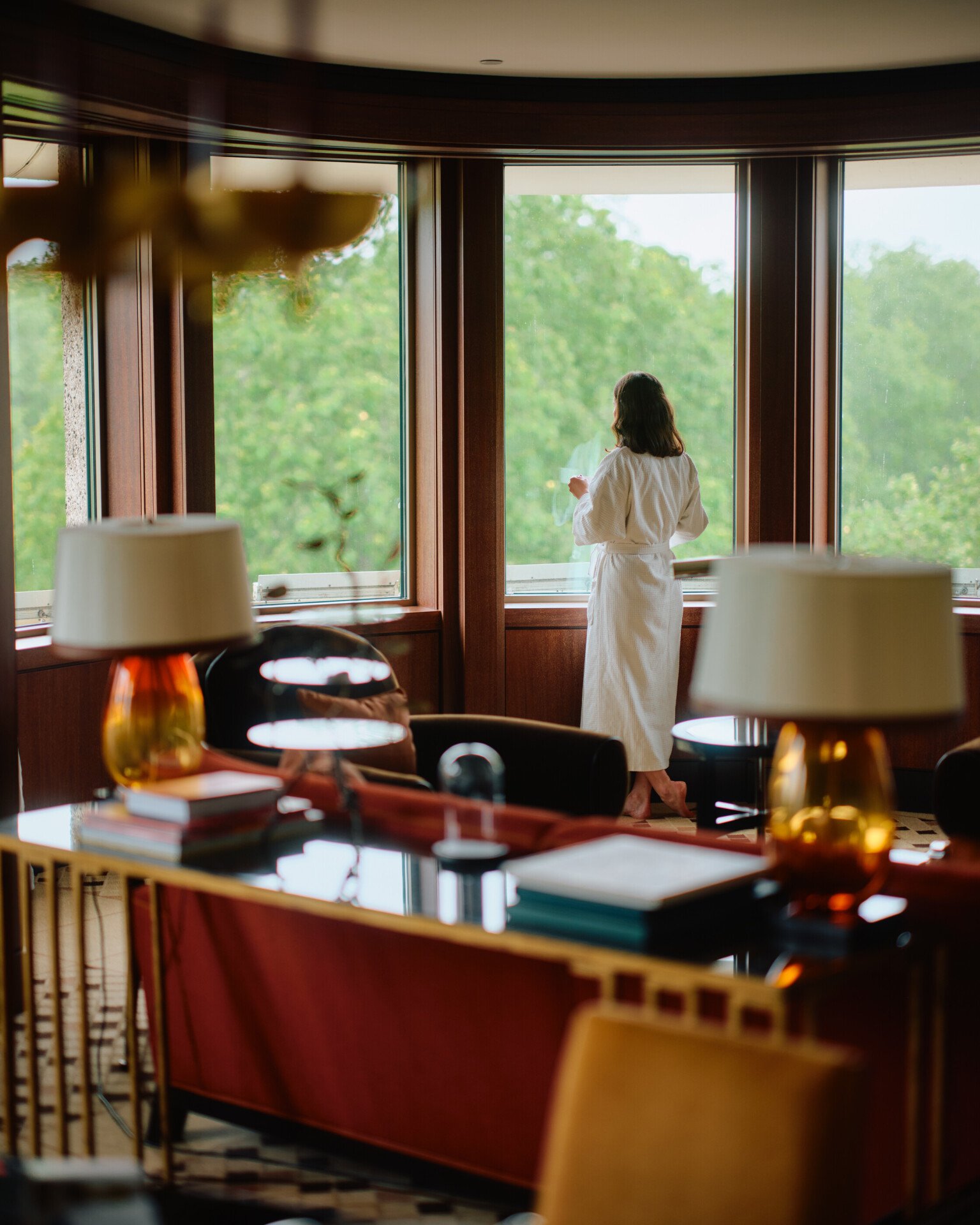 Woman looking out window of Park Lane Studio