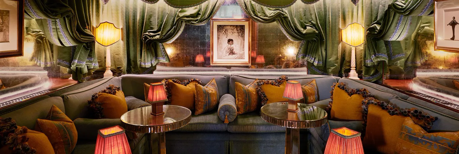 A cozy lounge with plush seating, warm lighting, and elegant curtains creating an inviting ambiance