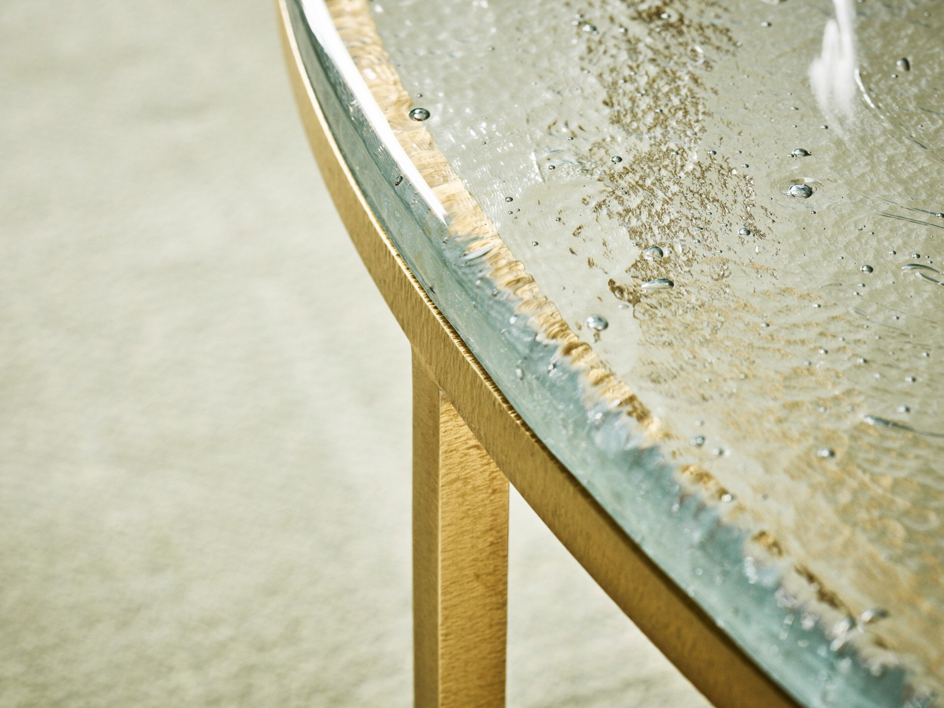Detail of small table with glass tabletop inside Junior Suite at Hotel Eden, Rome