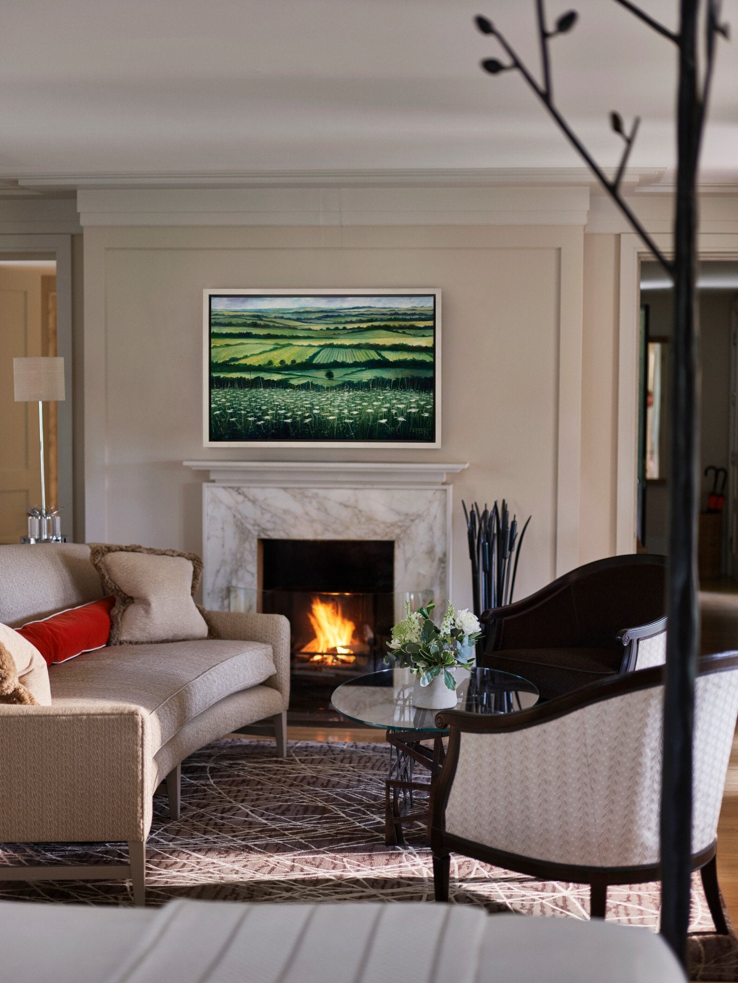 Gardener's East Cottage Suite living area with fireplace at Coworth Park, Ascot