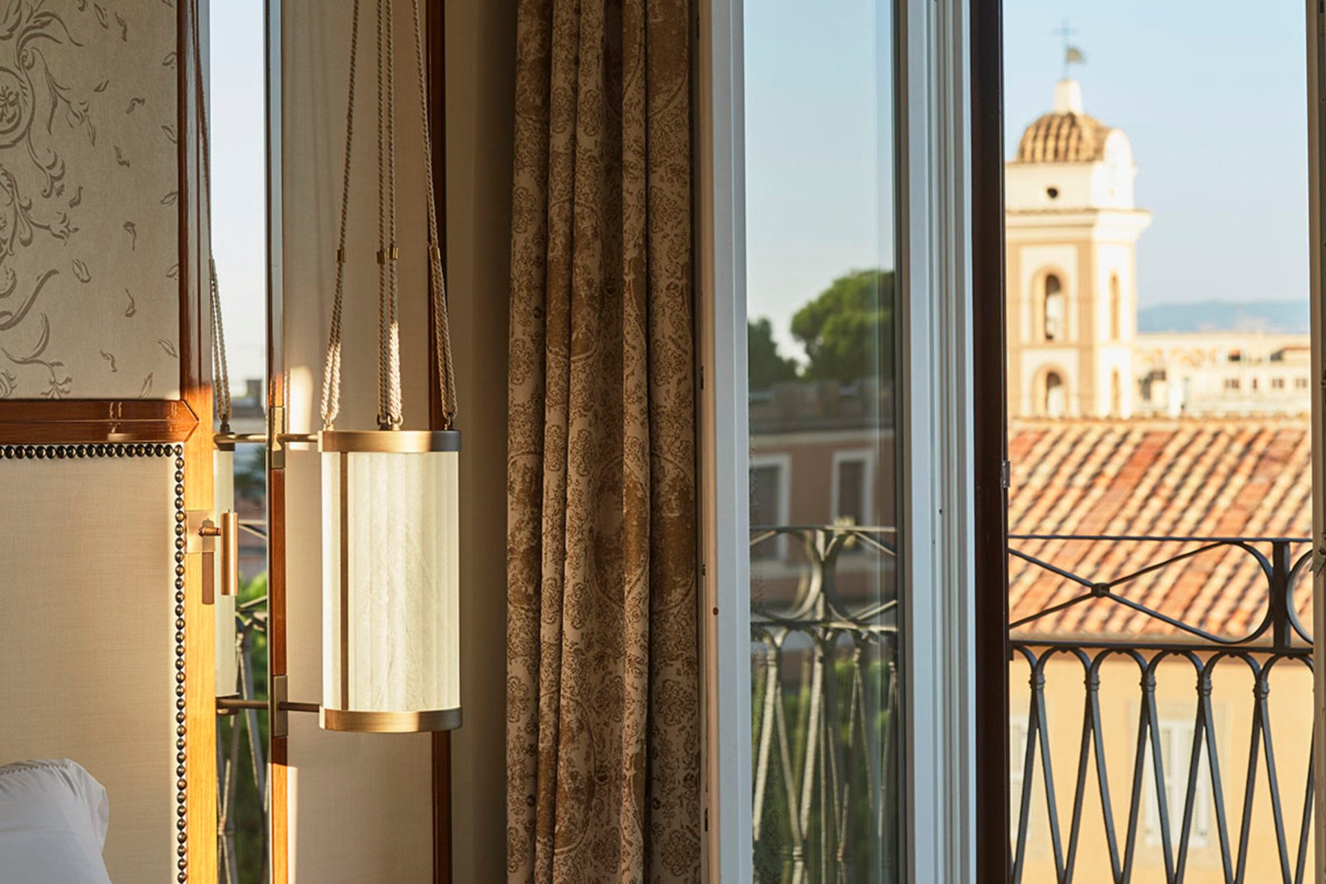 open window overlooking Rome view with lamp detail on the side