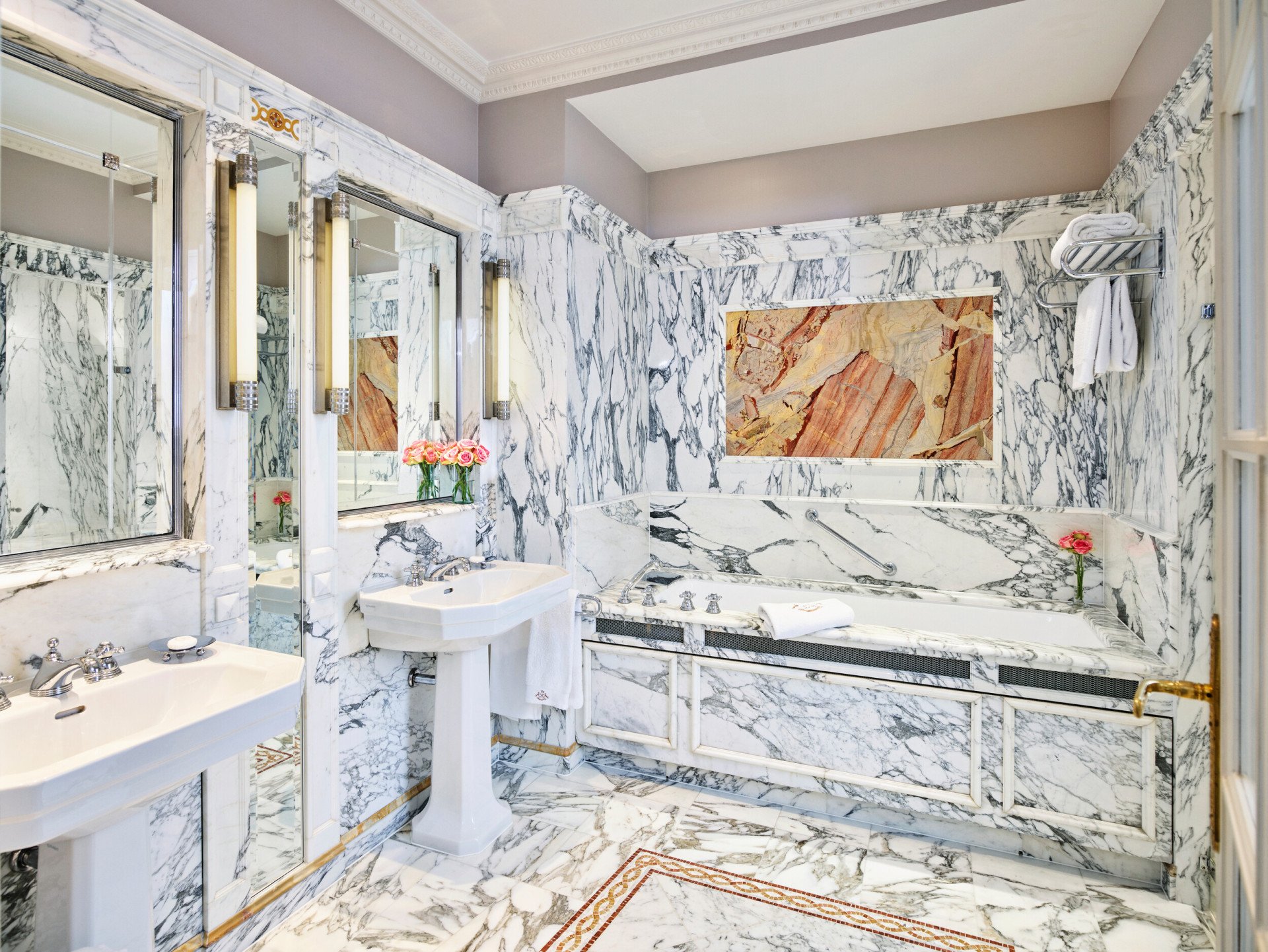 Landscape shot of the marble bathroom in the Versailles suite at Le Meurice, Paris.