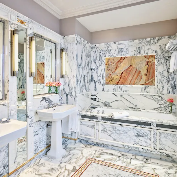 Landscape shot of the marble bathroom in the Versailles suite at Le Meurice, Paris.