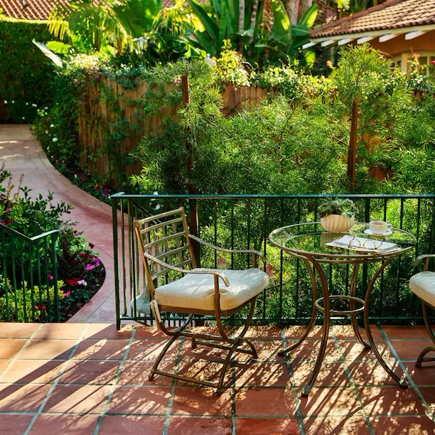 Bungalow Room Patio with glasses, script and coffee