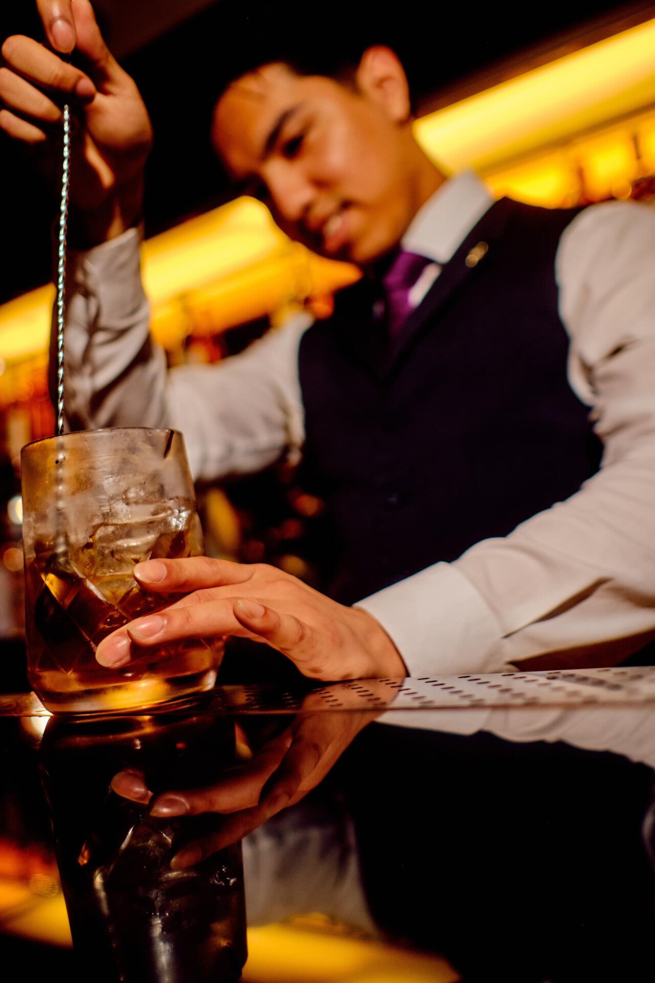 The Macallan Party at 45 Park Lane guests having a great time at night in Bar 45 with bartenders making cocktails