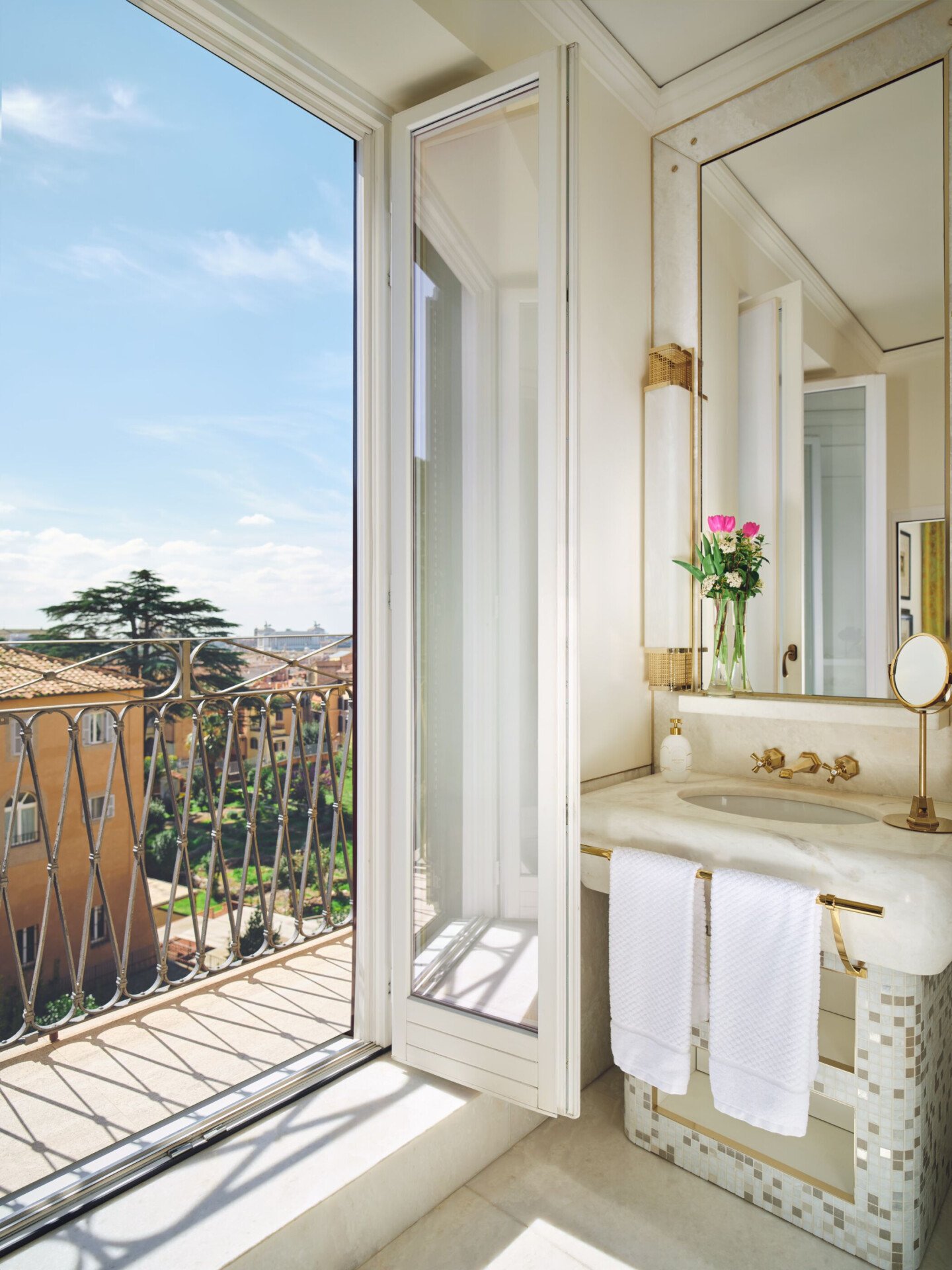 bathroom with open window on a ballcony at Hotel Eden Roma