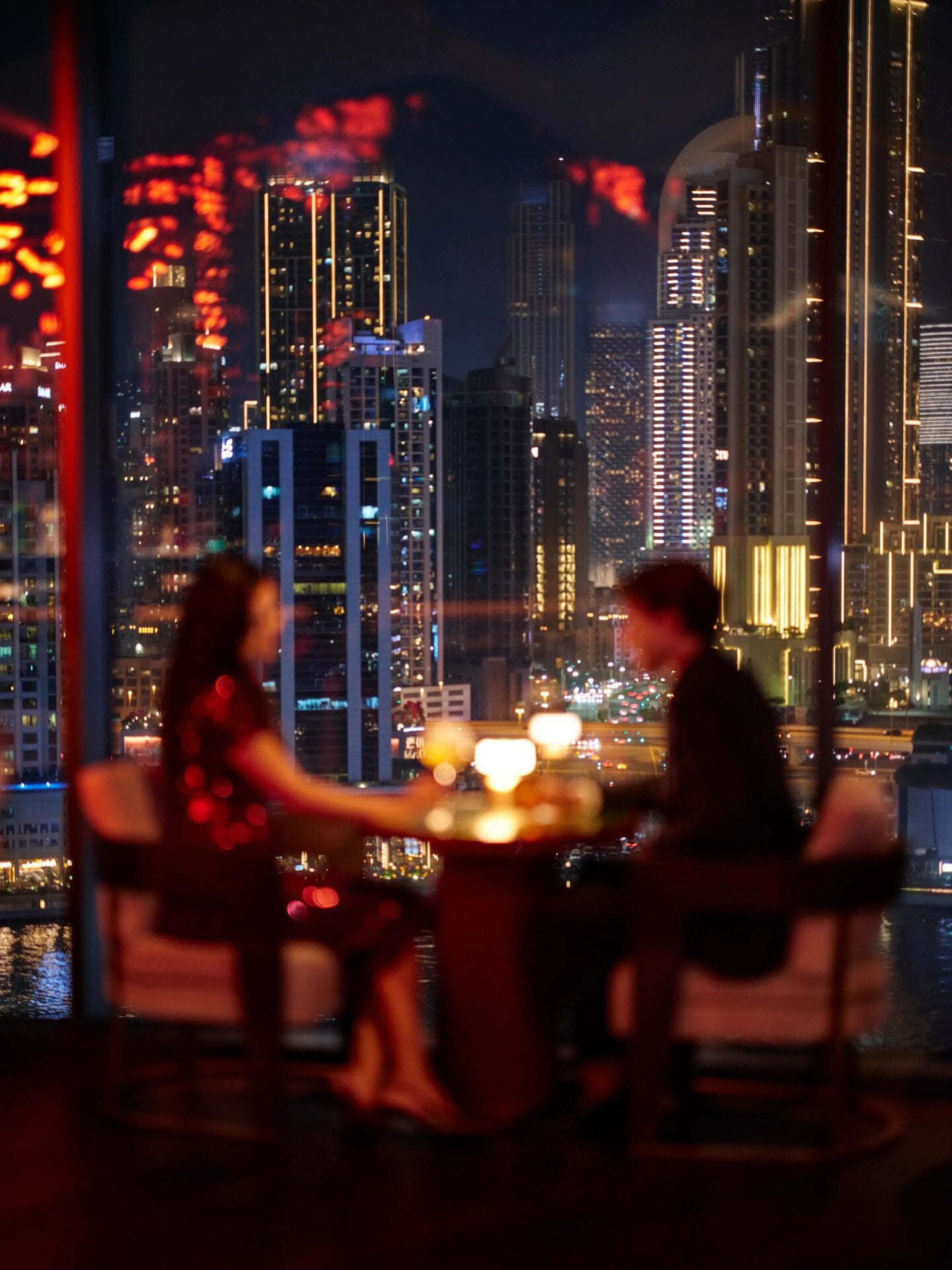 A couple enjoying drinks at Jara by Martin Berasategui