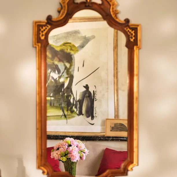 Mirror reflecting artwork at Eden Suite, Hotel Eden