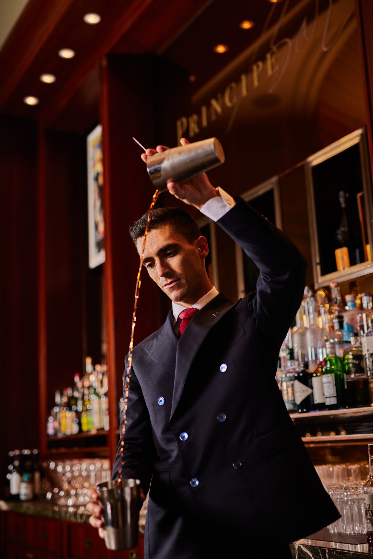 Daniele Celli, the bar manager, making cocktails