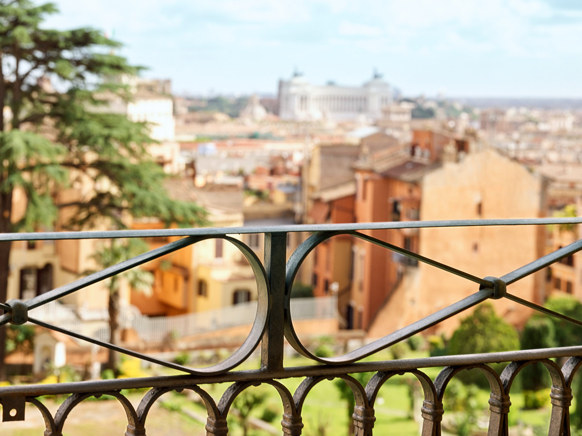 Balcony railing of Classic suite with view at Hotel Eden with view of Rome in the background