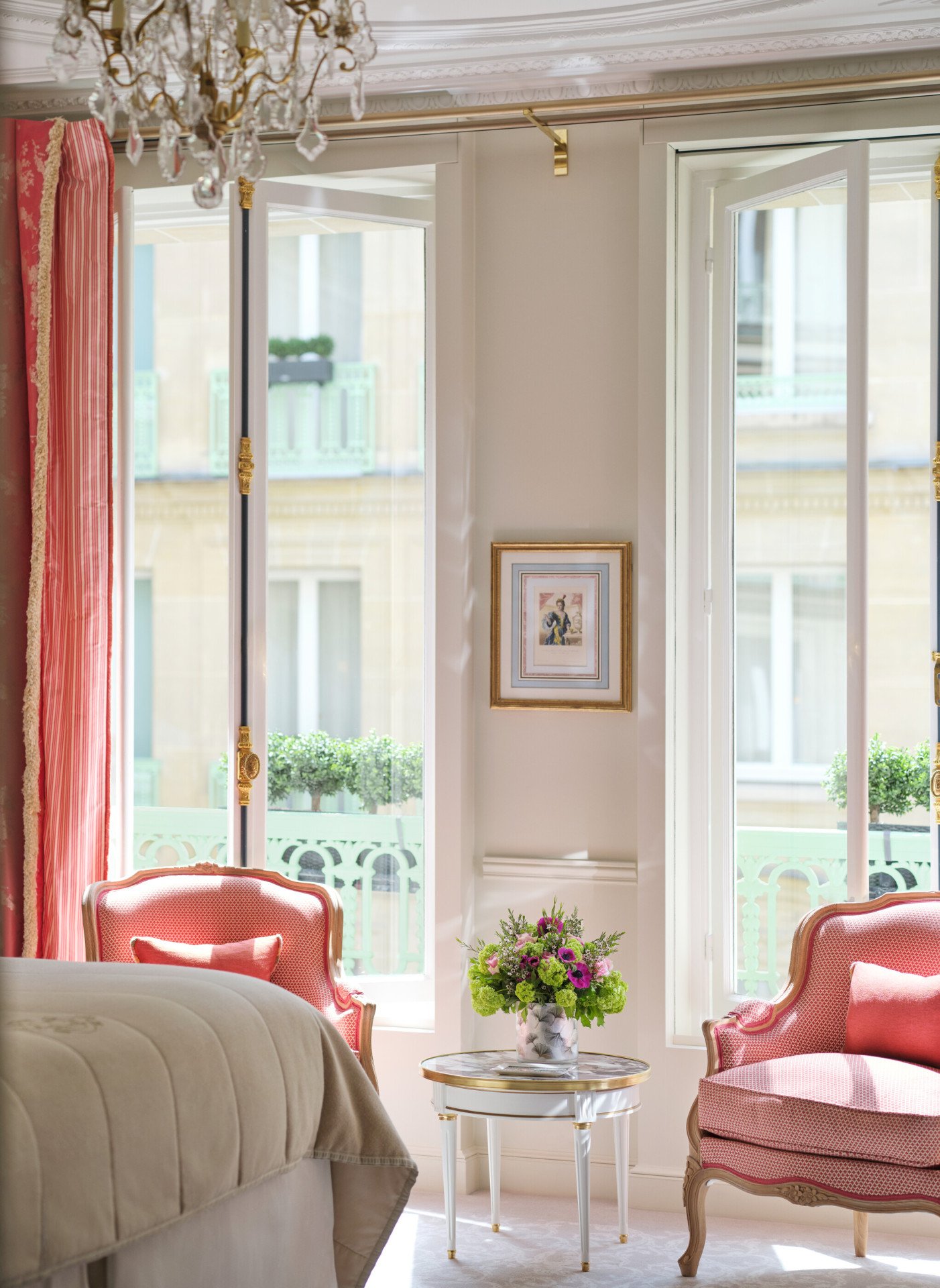 Highlighting of a deluxe room with the view on the chairs matching with the curtain in front of the windows, at Le Meurice, Paris