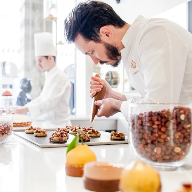 Cedric Grolet at work at boutique at Le Meurice, Paris
